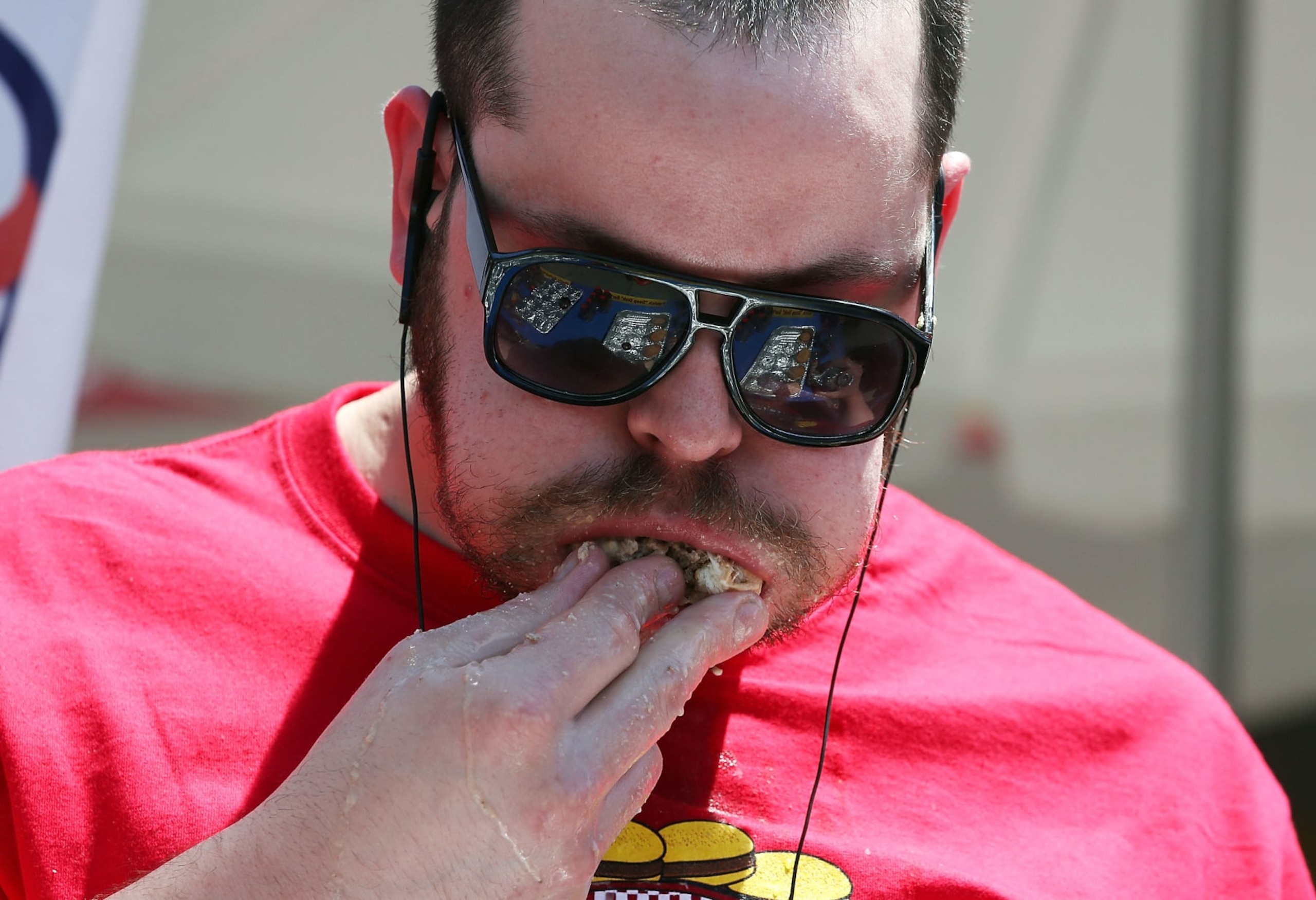 WASHINGTON, DC - JULY 03: Patrick "Deep Dish" Bertoletti eats a hamburger during Z Burger's eighth annual Independence Burger Eating Championship, on July 3, 2017 in Washington, DC. Molly Schuyler won the competition by eating 21 hamburgers.  (Photo by Mark Wilson/Getty Images)