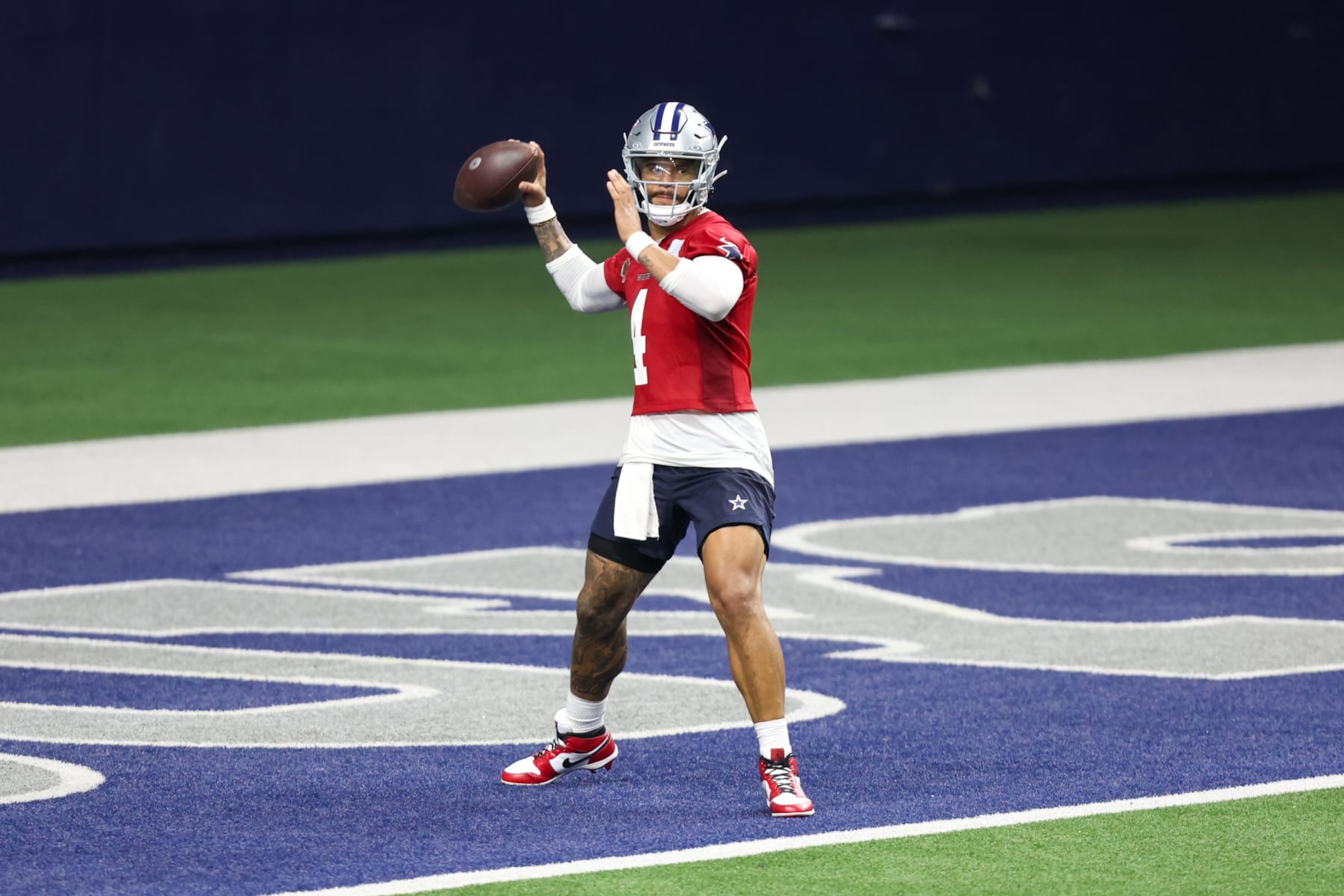 FRISCO, TX - MAY 22: Dallas Cowboys quarterback Dak Prescott (4) passes during the Dallas Cowboys OTAs on May 22, 2024 at The Star in Frisco, TX. (Photo by George Walker/Icon Sportswire via Getty Images) FRISCO, TX - MAY 22: Dallas Cowboys quarterback Dak Prescott (4) passes during the Dallas Cowboys OTAs on May 22, 2024 at The Star in Frisco, TX. (Photo by George Walker/Icon Sportswire via Getty Images)