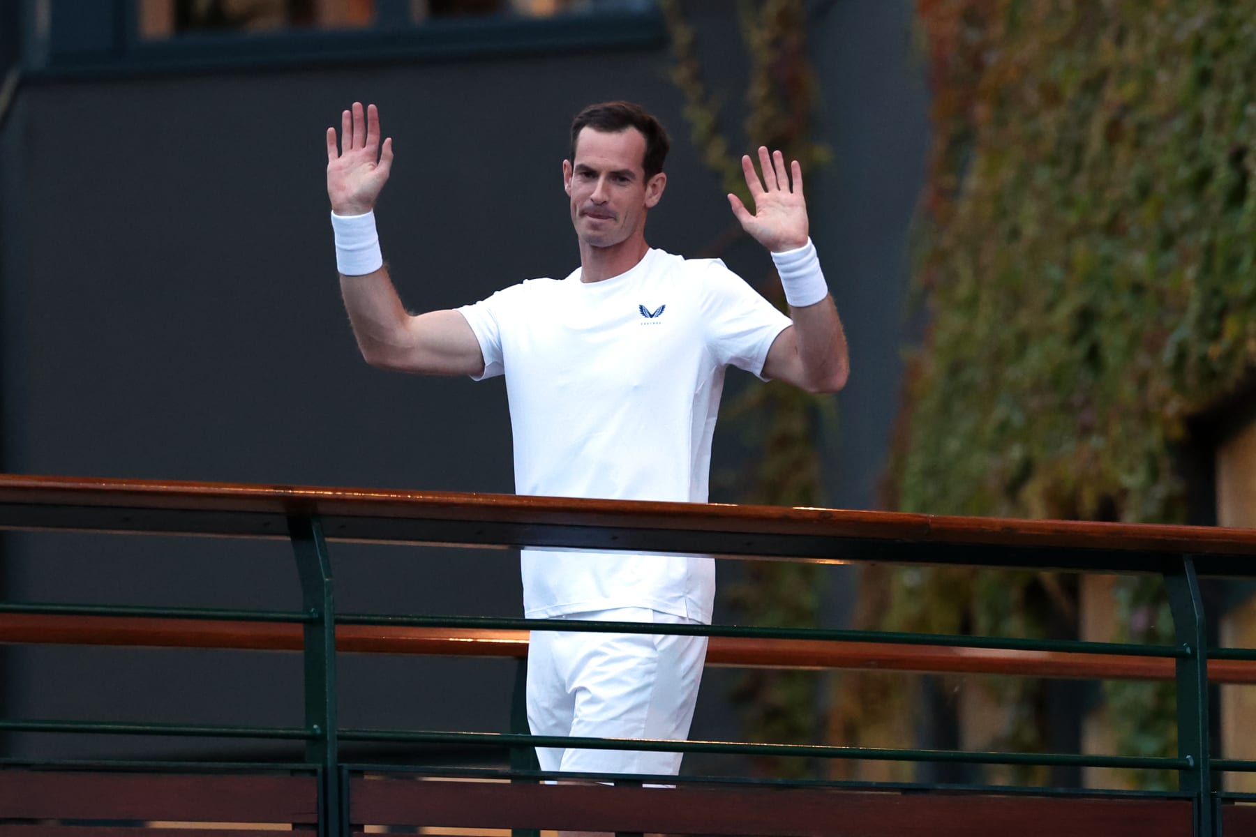 LONDON, ENGLAND - JULY 04: Andy Murray of Great Britain waves to the crowd on the player's walkway bridge following the Gentlemen’s Doubles first round match with Jamie Murray against Rinky Hijikata and John Peers of Australia during day four of The Championships Wimbledon 2024 at All England Lawn Tennis and Croquet Club on July 04, 2024 in London, England. (Photo by Sean M. Haffey/Getty Images)