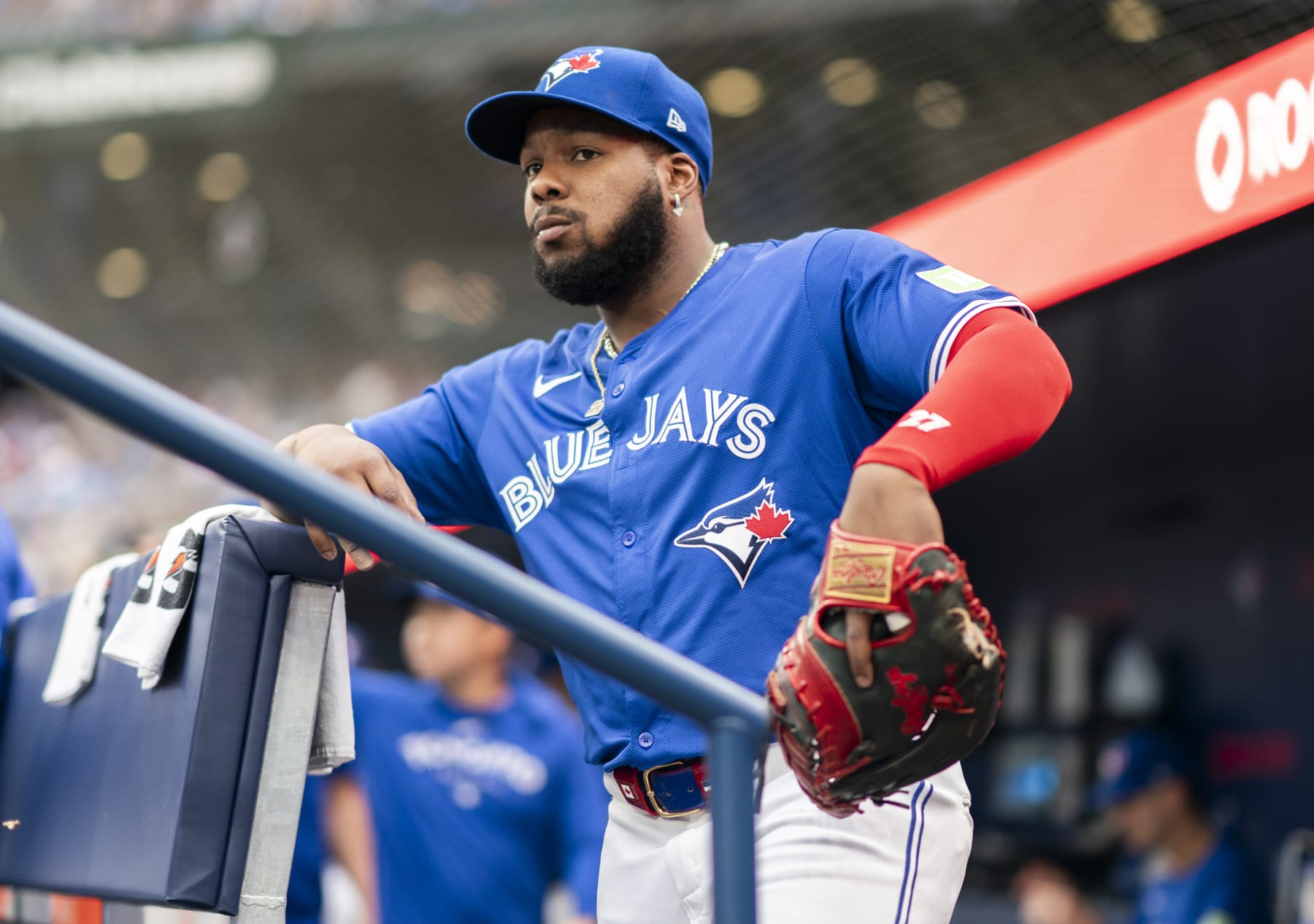 TORONTO, ON - JULY 2: Vladimir Guerrero Jr. #27 of Toronto Blue Jays looks on from the dugout before playing the Houston Astros in their MLB game at the Rogers Centre on July 2, 2024 in Toronto, Ontario, Canada. (Photo by Mark Blinch/Getty Images)