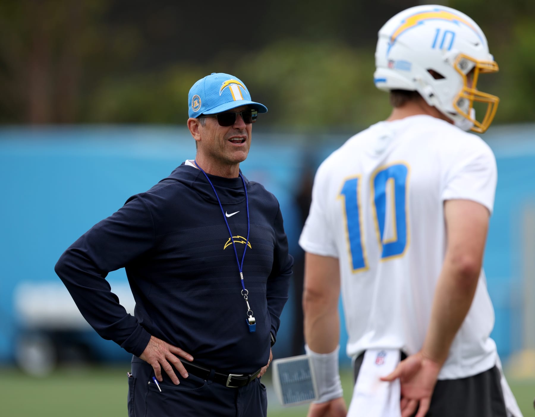COSTA MESA, CALIFORNIA - MAY 20: Head coach Jim Harbaugh and quarterback Justin Herbert during a Los Angeles Chargers OTA offseason workout on May 20, 2024 in Costa Mesa, California. (Photo by Harry How/Getty Images)