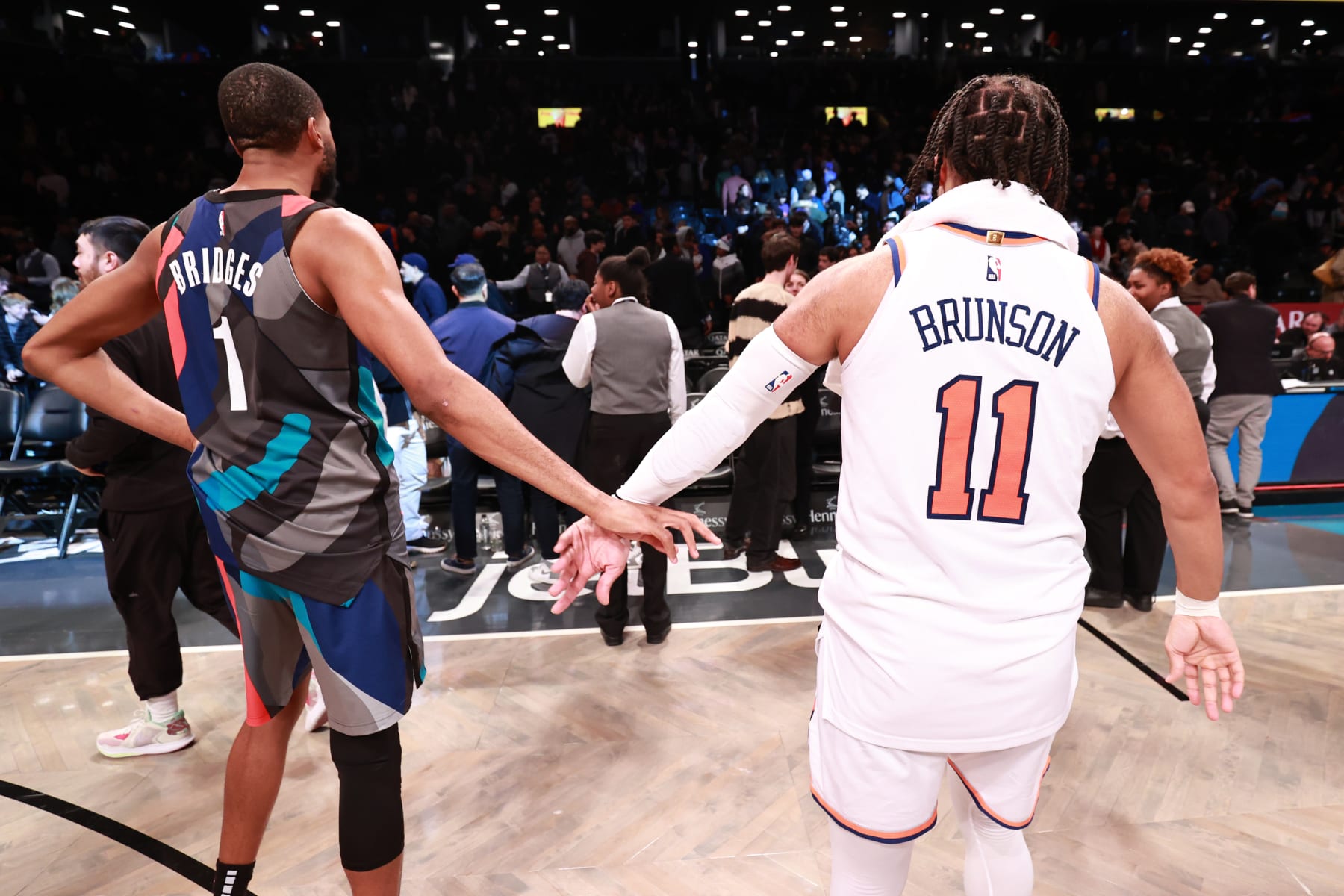 BROOKLYN, NY - DECEMBER 20: Mikal Bridges #1 of the Brooklyn Nets high fives Jalen Brunson #11 of the New York Knicks after the game on December 20, 2023 at Barclays Center in Brooklyn, New York. NOTE TO USER: User expressly acknowledges and agrees that, by downloading and or using this Photograph, user is consenting to the terms and conditions of the Getty Images License Agreement. Mandatory Copyright Notice: Copyright 2023 NBAE (Photo by Nathaniel S. Butler/NBAE via Getty Images)