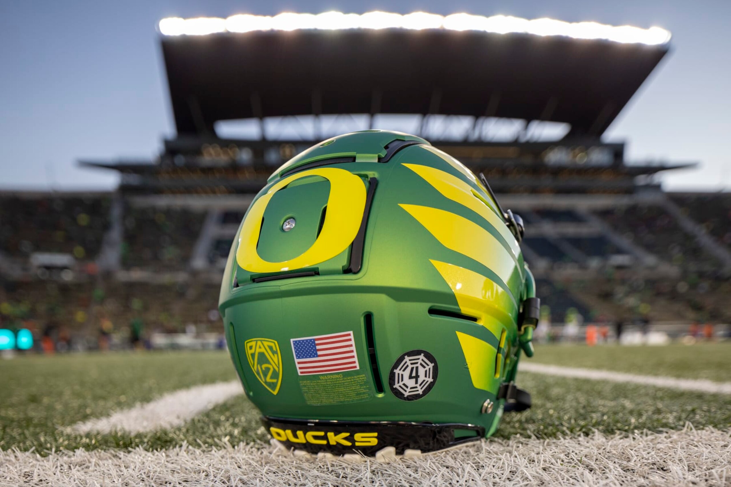 EUGENE, OREGON - NOVEMBER 24: An Oregon Ducks helmet on the field at Autzen Stadium before the football game between the Oregon Ducks and the Oregon State Beavers at Autzen Stadium November 24, 2023 in Eugene, Oregon. (Photo by Tom Hauck/Getty Images) EUGENE, OREGON - NOVEMBER 24: An Oregon Ducks helmet on the field at Autzen Stadium before the football game between the Oregon Ducks and the Oregon State Beavers at Autzen Stadium November 24, 2023 in Eugene, Oregon. (Photo by Tom Hauck/Getty Images)