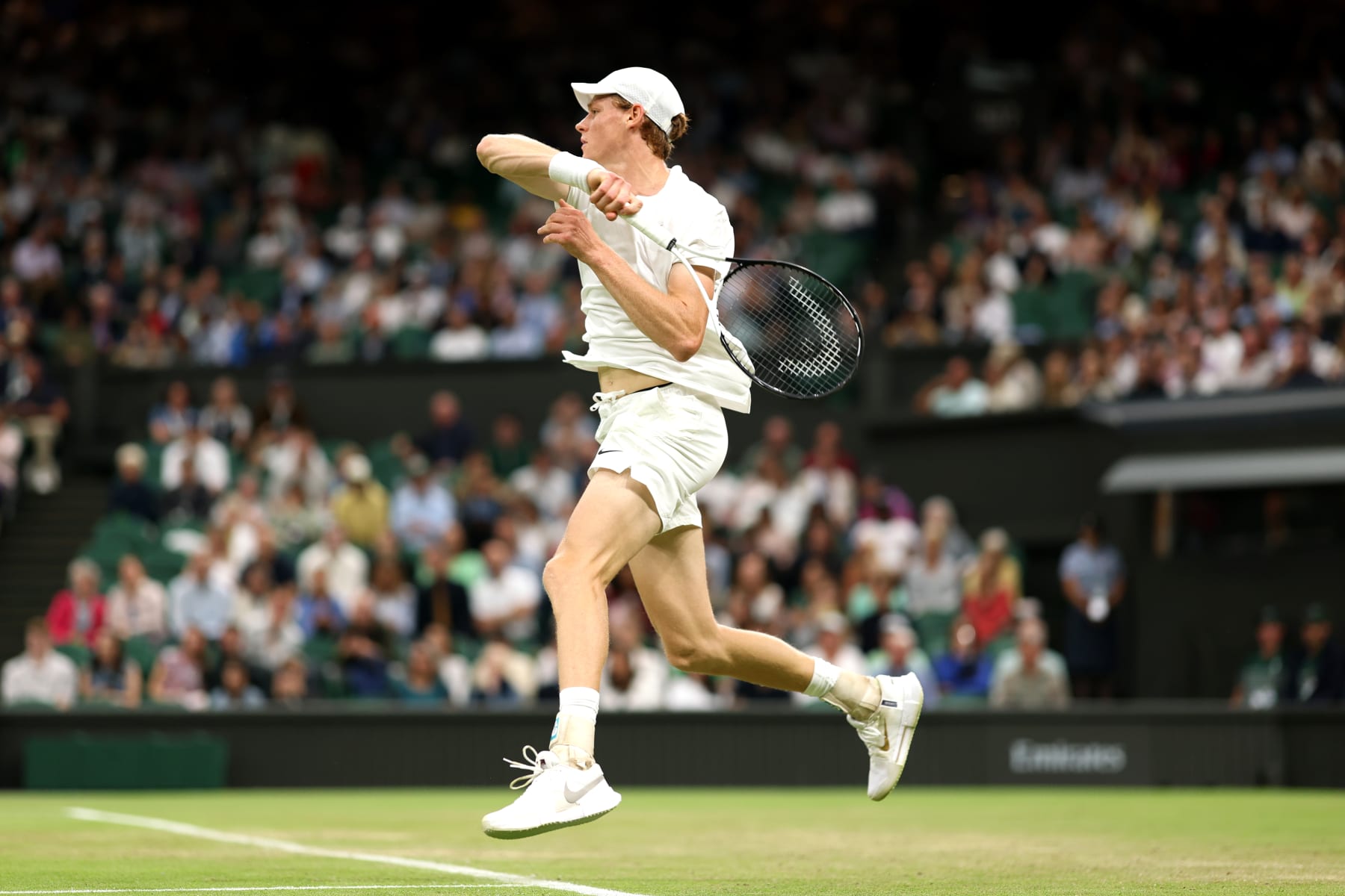 LONDON, ENGLAND - JULY 05: Jannik Sinner of Italy plays a forehand against Miomir Kecmanovic of Serbia in the Gentleman's Singles third round match during day five of The Championships Wimbledon 2024 at All England Lawn Tennis and Croquet Club on July 05, 2024 in London, England. (Photo by Julian Finney/Getty Images)