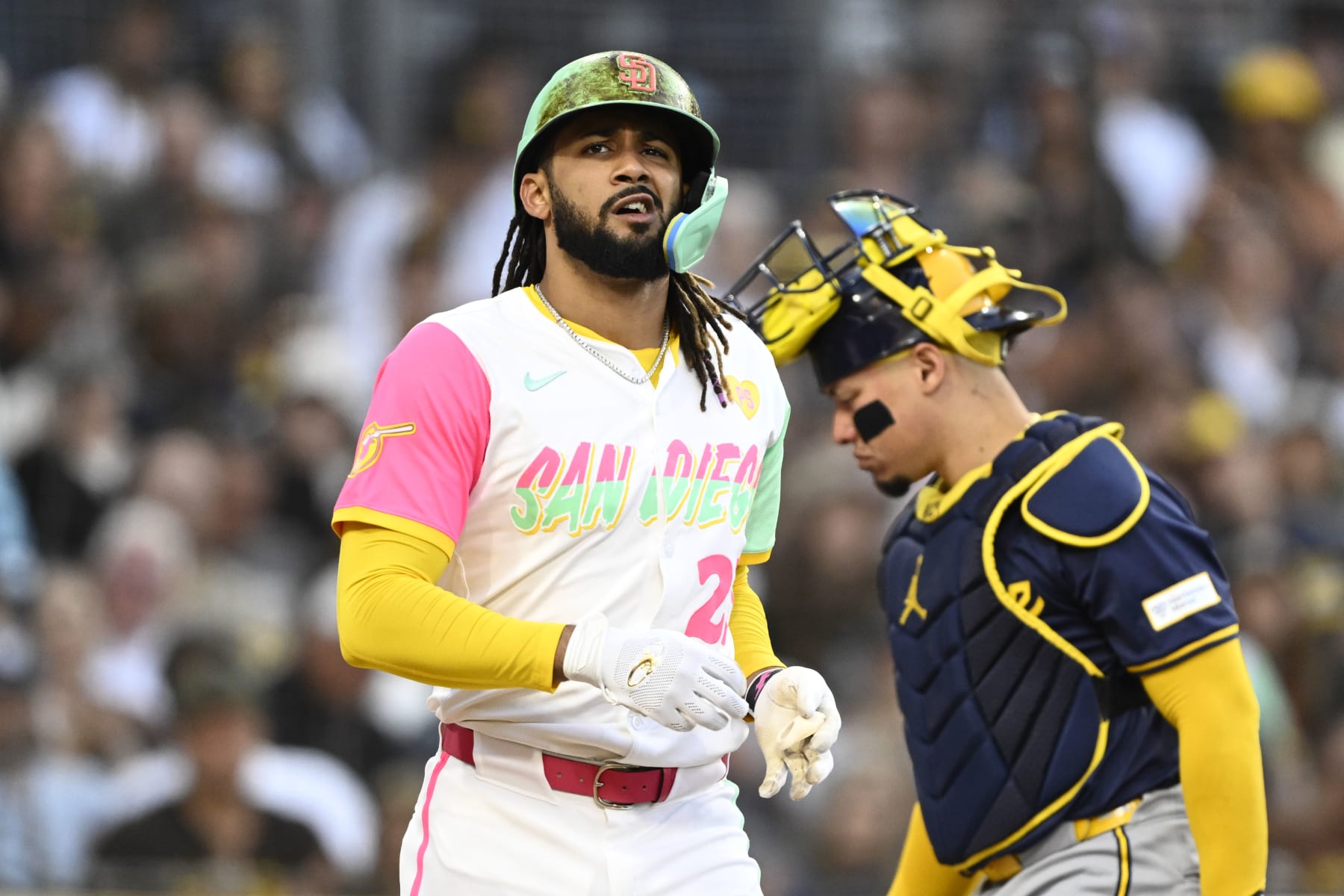 SAN DIEGO, CA - JUNE 21: Fernando Tatis Jr. #23 of the San Diego Padres walks to first base after being hit with a pitch during the third inning of a baseball game against the Milwaukee Brewers June 21, 2024 at Petco Park in San Diego, California. (Photo by Denis Poroy/Getty Images)