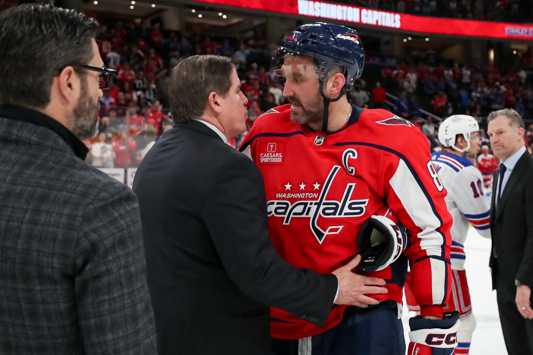 WASHINGTON, DC - APRIL 28: Alex Ovechkin #8 of the Washington Capitals shakes hands with New York Rangers head coach Peter Laviolette in the hand shake line in Game Four of the First Round of the 2024 Stanley Cup Playoffs at Capital One Arena on April 28, 2024 in Washington, D.C. (Photo by John McCreary/NHLI via Getty Images)