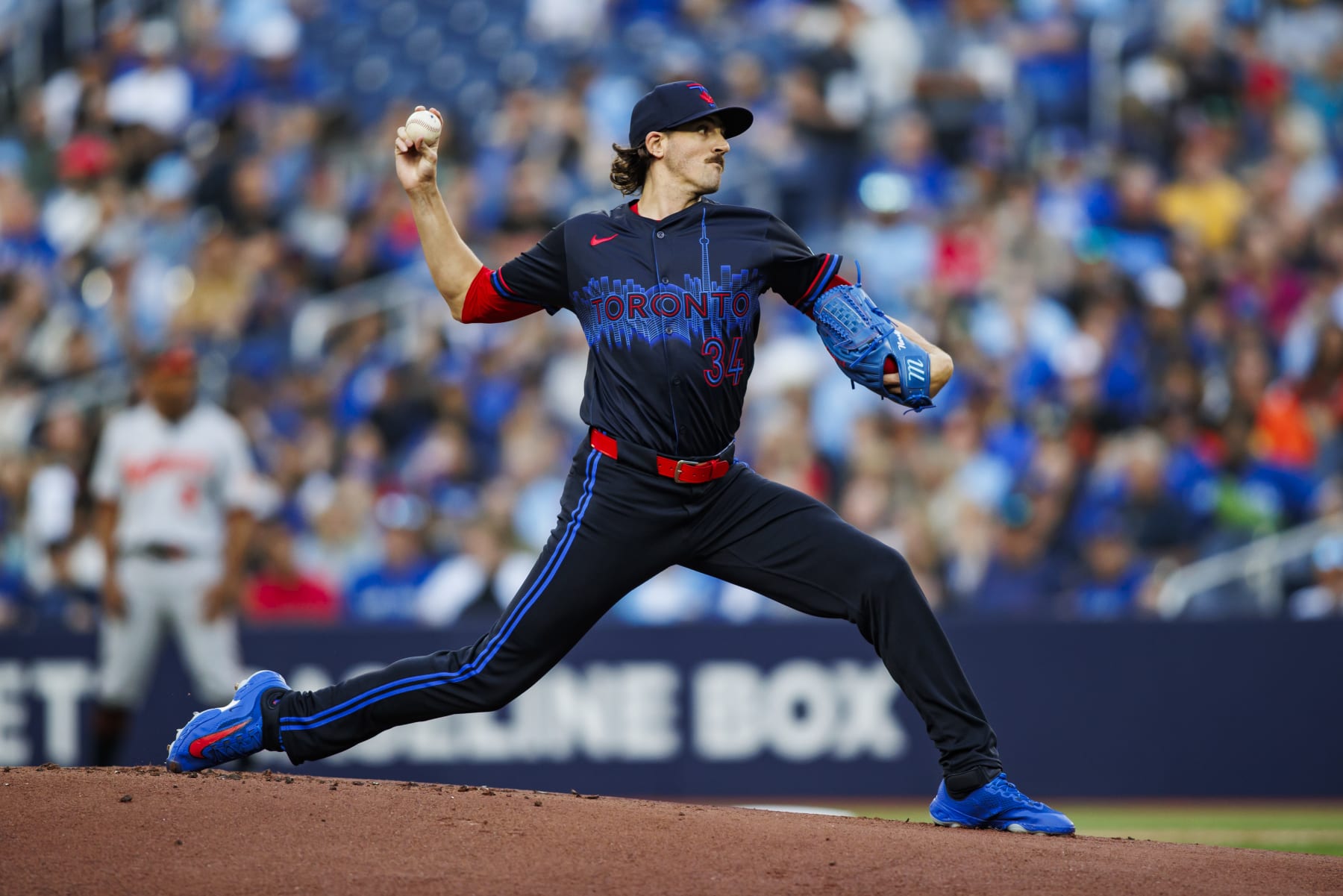 TORONTO, CANADA - JUNE 3: Kevin Gausman #34 of the Toronto Blue Jays pitches during the first inning of the game against the Baltimore Orioles at Rogers Centre on June 3, 2024 in Toronto, Ontario, Canada. (Photo by Cole Burston/Getty Images)