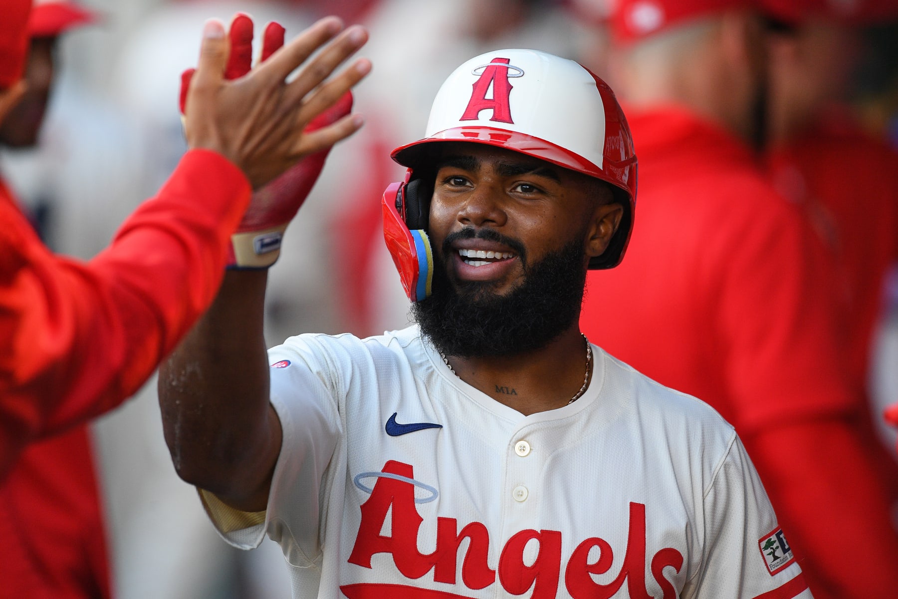 ANAHEIM, CA - JUNE 24: Los Angeles Angels third baseman Luis Rengifo (2) gets a high five after scoring a run during the MLB game between the Oakland Athletics and the Los Angeles Angels of Anaheim on June 24, 2024 at Angel Stadium of Anaheim in Anaheim, CA. (Photo by Brian Rothmuller/Icon Sportswire via Getty Images)