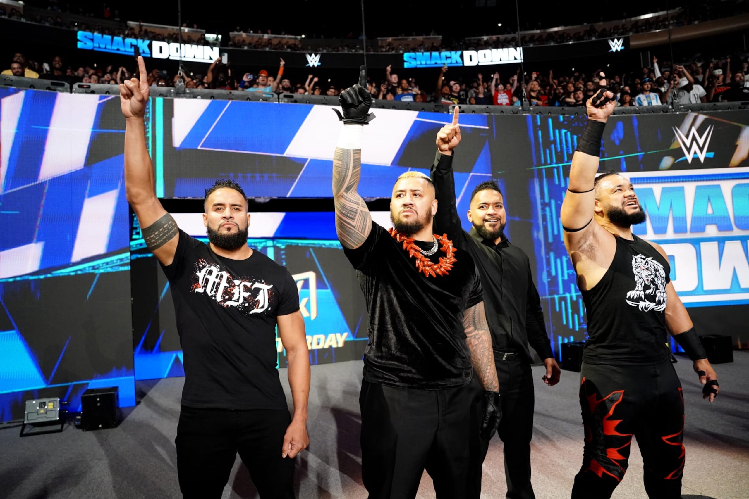 NEW YORK, NEW YORK - JUNE 28: (L-R) Tara Tonga, Solo Sikoa, Tonga Loa and Jacob Fatu all of the Bloodline hold up the one sign during WWE SmackDown at Madison Square Garden on June 28, 2024 in New York City. (Photo by WWE/Getty Images) NEW YORK, NEW YORK - JUNE 28: (L-R) Tara Tonga, Solo Sikoa, Tonga Loa and Jacob Fatu all of the Bloodline hold up the one sign during WWE SmackDown at Madison Square Garden on June 28, 2024 in New York City. (Photo by WWE/Getty Images)