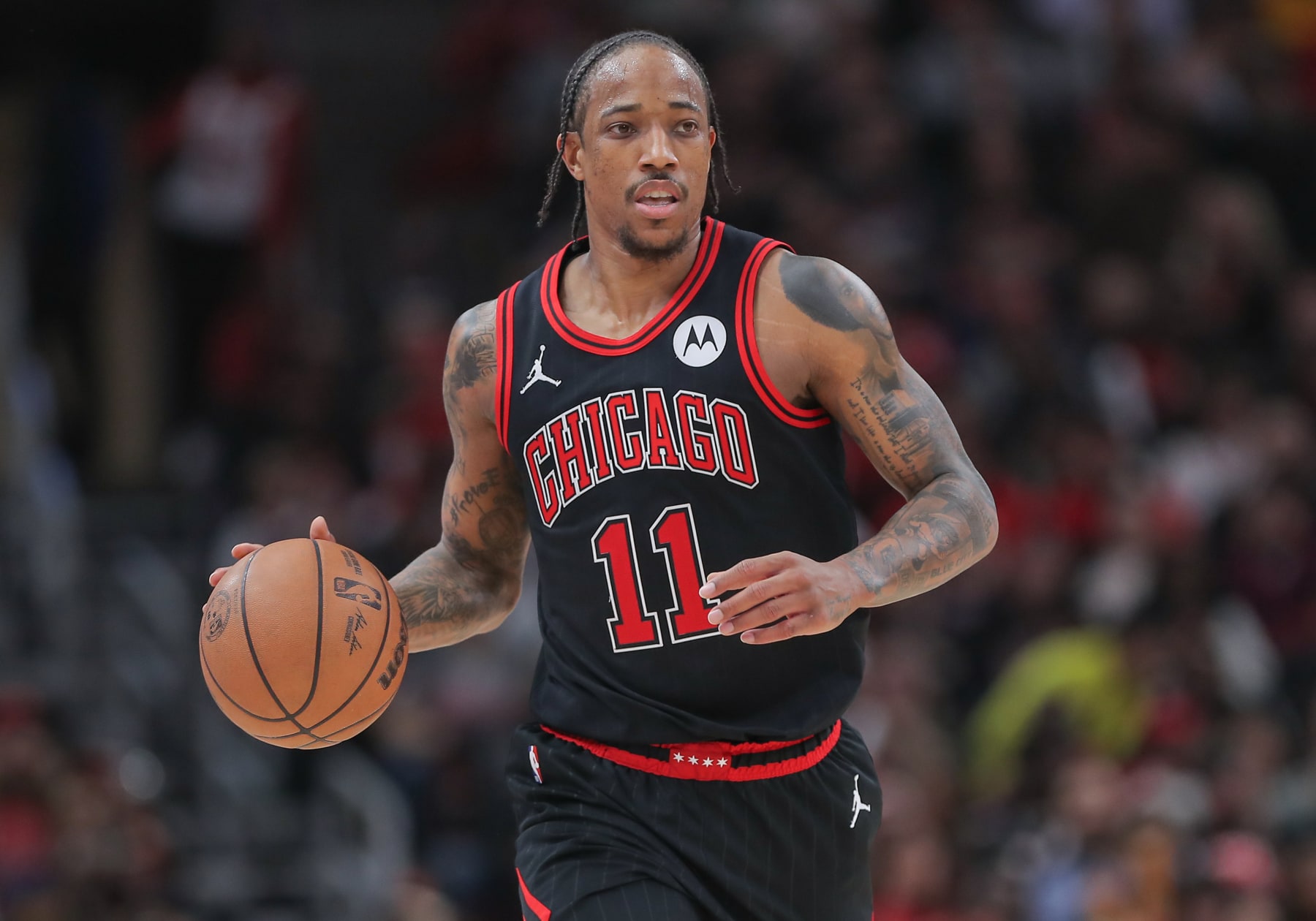 CHICAGO, IL - APRIL 17: DeMar DeRozan #11 of the Chicago Bulls brings the ball up court during the second half of the 2024 Play-In Tournament against the Atlanta Hawks at the United Center on April 17, 2024 in Chicago, Illinois. (Photo by Melissa Tamez/Icon Sportswire via Getty Images)