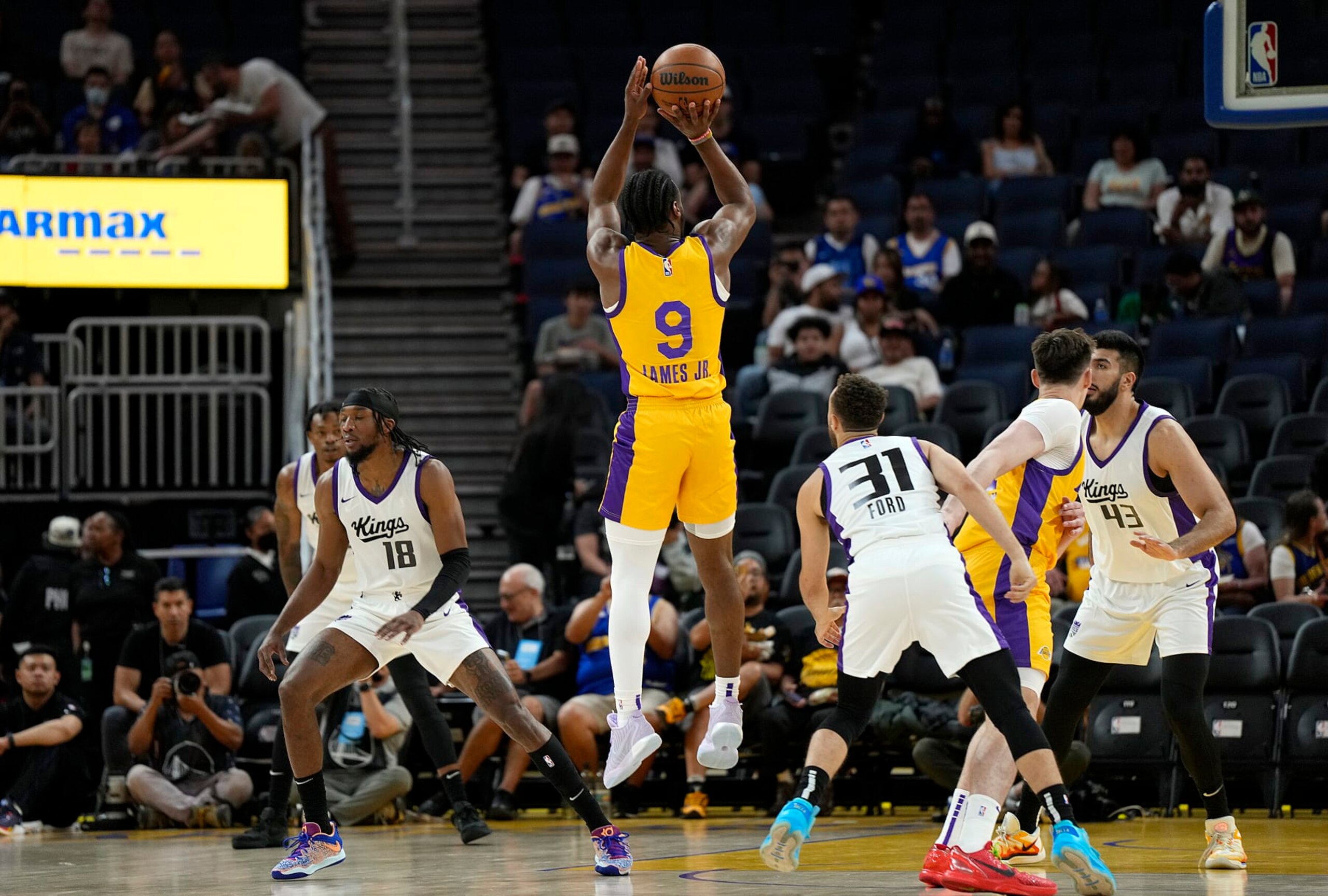 SAN FRANCISCO, CALIFORNIA - JULY 06: Bronny James Jr. #9 of the Los Angeles Lakers shoots over Jordan Ford #31 of the Sacramento Kings during the first half of a 2024 California Classic summer league game at Chase Center on July 06, 2024 in San Francisco, California. NOTE TO USER: User expressly acknowledges and agrees that, by downloading and or using this photograph, User is consenting to the terms and conditions of the Getty Images License Agreement. (Photo by Thearon W. Henderson/Getty Images)
