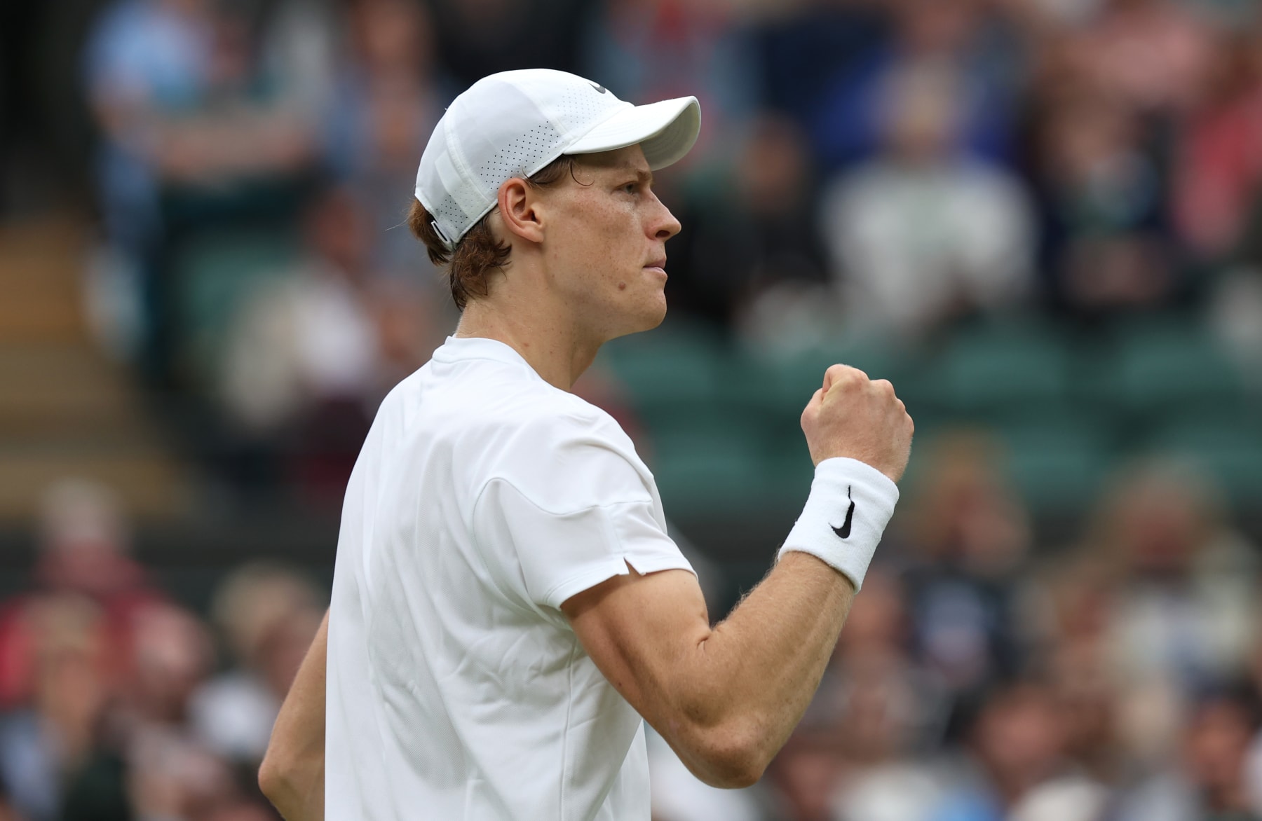 LONDON, ENGLAND - JULY 07: Jannik Sinner of Italy celebrates as he plays against Ben Shelton of United States in his Gentleman's Singles fourth round match during day seven of The Championships Wimbledon 2024 at All England Lawn Tennis and Croquet Club on July 07, 2024 in London, England. (Photo by Francois Nel/Getty Images)
