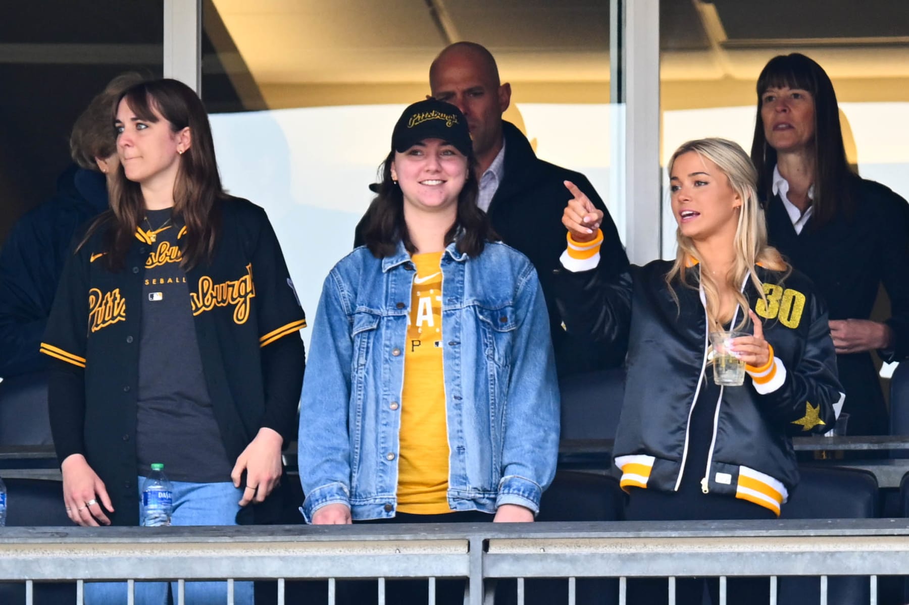 PITTSBURGH, PA - MAY 11:   Guests of Paul Skenes #30 of the Pittsburgh Pirates including Olivia 'Livvy' Dunne look on from their seats during the game between the Chicago Cubs and the Pittsburgh Pirates at PNC Park on Saturday, May 11, 2024 in Pittsburgh, Pennsylvania. (Photo by Joe Sargent/MLB Photos via Getty Images)