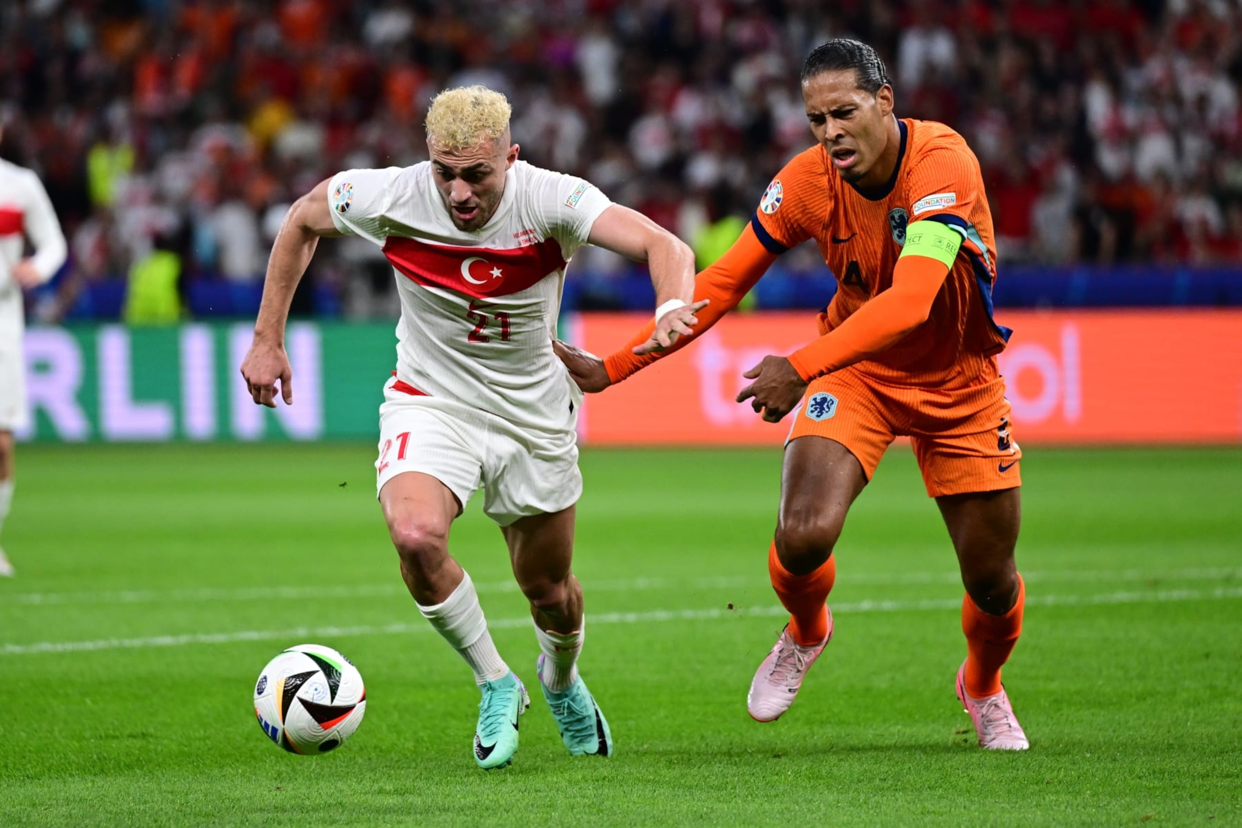 BERLIN, GERMANY - JULY 06: Baris Alper Yilmaz (21) of Turkiye is in action against Virgil van Dijk (4) of Netherlands during the UEFA EURO 2024 Quarter-Final football match between Netherlands and Turkiye at Olympiastadion in Berlin, Germany on July 06, 2024. (Photo by Oguz Yeter/Anadolu via Getty Images) BERLIN, GERMANY - JULY 06: Baris Alper Yilmaz (21) of Turkiye is in action against Virgil van Dijk (4) of Netherlands during the UEFA EURO 2024 Quarter-Final football match between Netherlands and Turkiye at Olympiastadion in Berlin, Germany on July 06, 2024. (Photo by Oguz Yeter/Anadolu via Getty Images)