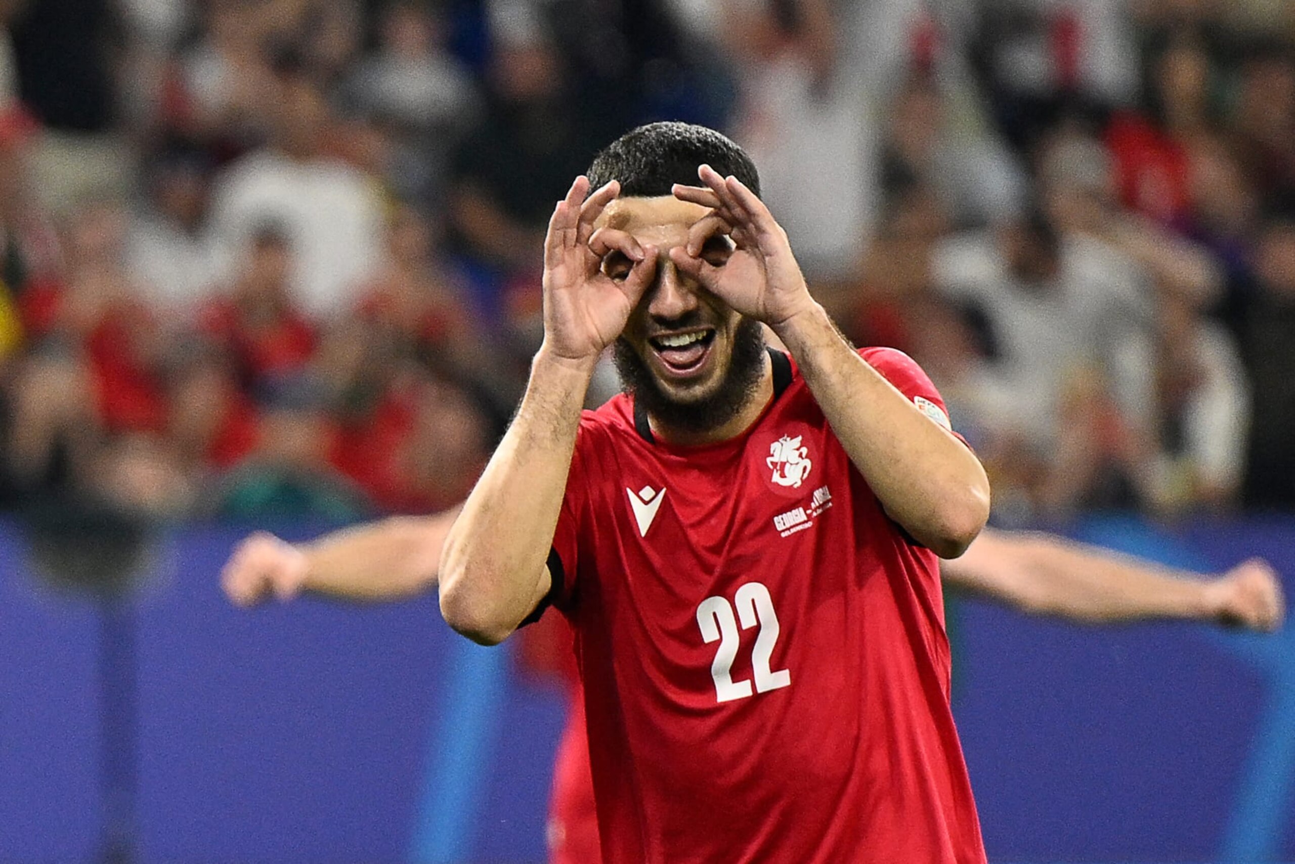 Georgia's forward #22 Georges Mikautadze celebrates scoring his team's second goal during the UEFA Euro 2024 Group F football match between Georgia and Portugal at the Arena AufSchalke in Gelsenkirchen on June 26, 2024. (Photo by INA FASSBENDER / AFP) (Photo by INA FASSBENDER/AFP via Getty Images) Georgia's forward #22 Georges Mikautadze celebrates scoring his team's second goal during the UEFA Euro 2024 Group F football match between Georgia and Portugal at the Arena AufSchalke in Gelsenkirchen on June 26, 2024. (Photo by INA FASSBENDER / AFP) (Photo by INA FASSBENDER/AFP via Getty Images)