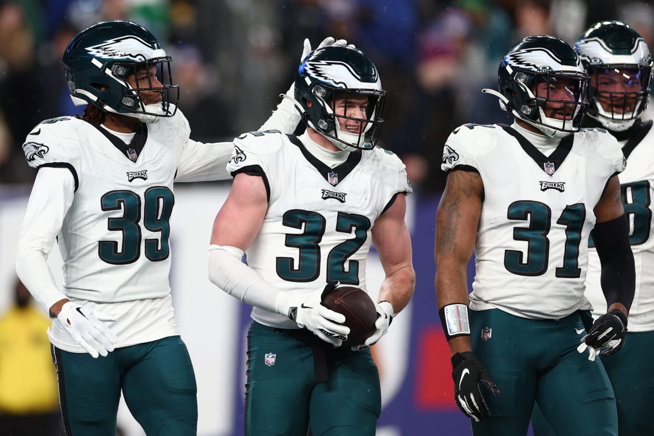 EAST RUTHERFORD, NEW JERSEY - JANUARY 07: Reed Blankenship #32 of the Philadelphia Eagles celebrates an interception with Eli Ricks #39 during the second quarter in the game against the New York Giants at MetLife Stadium on January 07, 2024 in East Rutherford, New Jersey. (Photo by Elsa/Getty Images)