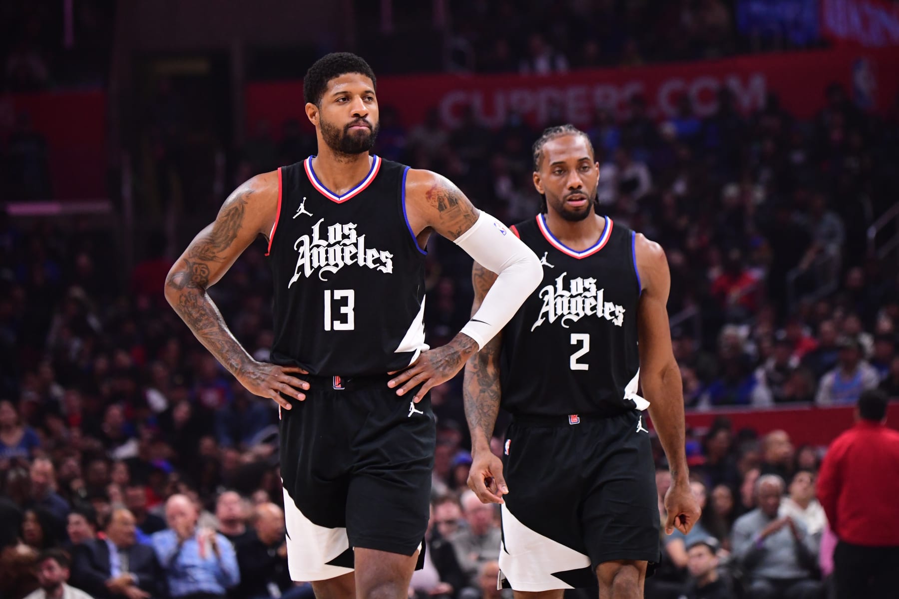 LOS ANGELES, CA - FEBRUARY 7: Paul George #13 and Kawhi Leonard #2 of the LA Clippers look on during the game against the New Orleans Pelicans on February 7, 2024 at Crypto.Com Arena in Los Angeles, California. NOTE TO USER: User expressly acknowledges and agrees that, by downloading and/or using this Photograph, user is consenting to the terms and conditions of the Getty Images License Agreement. Mandatory Copyright Notice: Copyright 2024 NBAE (Photo by Adam Pantozzi/NBAE via Getty Images)