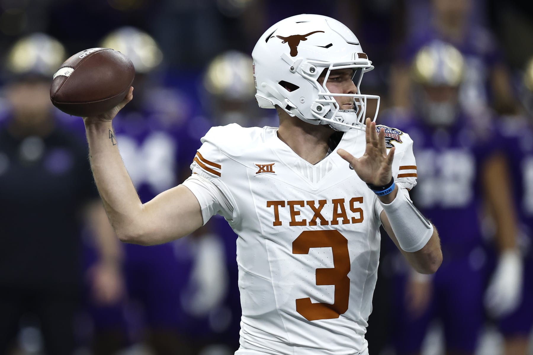 NEW ORLEANS, LOUISIANA - JANUARY 01: Quinn Ewers #3 of the Texas Longhorns looks to pass during the first quarter against the Washington Huskies during the CFP Semifinal Allstate Sugar Bowl at Caesars Superdome on January 01, 2024 in New Orleans, Louisiana. (Photo by Chris Graythen/Getty Images)