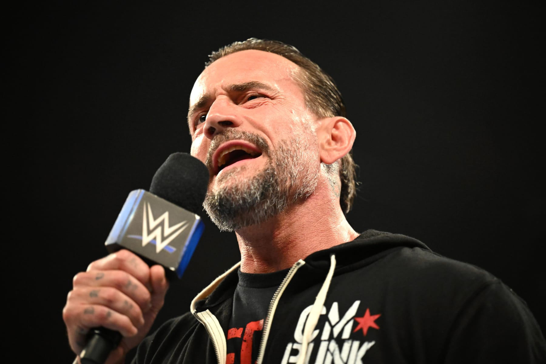 ROSEMONT, ILLINOIS - JUNE 21: CM Punk addresses the fans during WWE SmackDown at Allstate Arena on June 21, 2024 in Rosemont, Illinois.  (Photo by WWE/Getty Images)