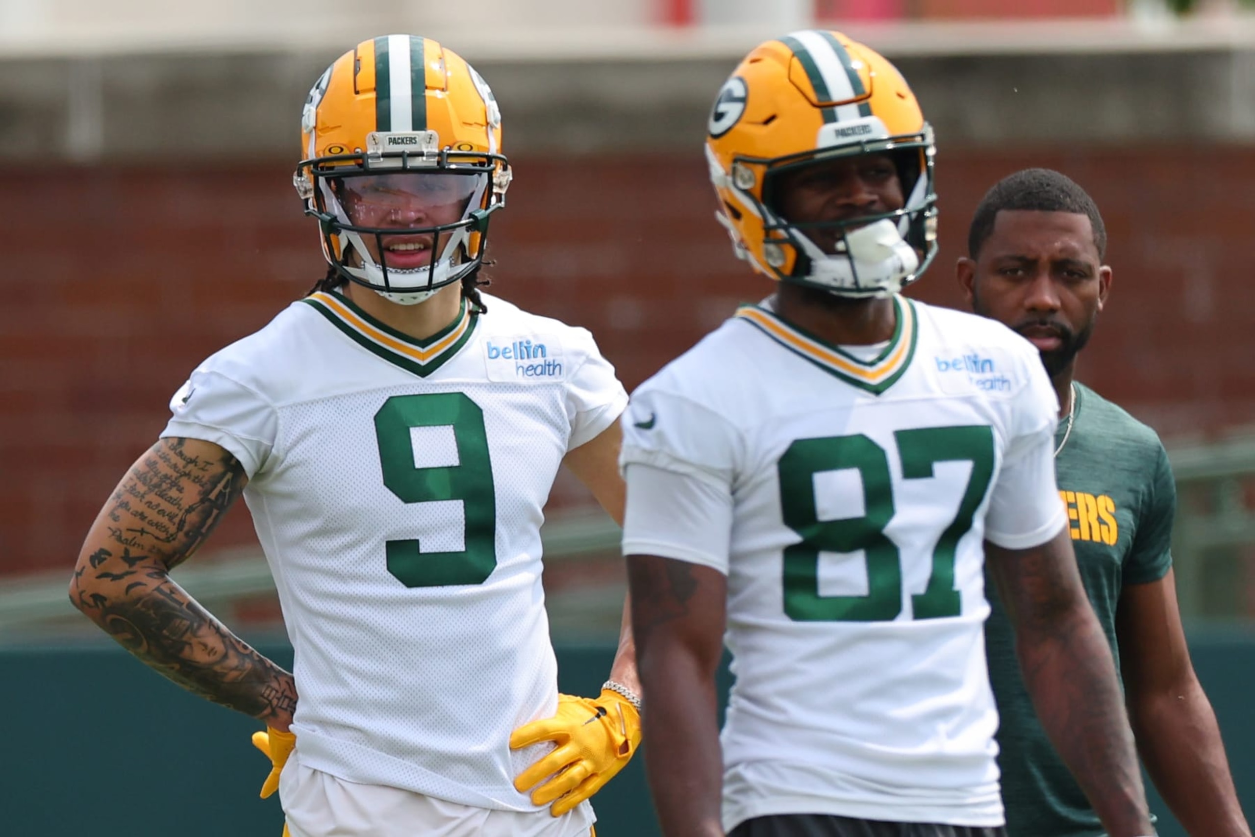 GREEN BAY, WISCONSIN - JUNE 04: Christian Watson #9 and Romeo Doubs #87 of the Green Bay Packers participate in drills during the Green Bay Packers Minicamp at Ray Nitschke Field on June 04, 2024 in Green Bay, Wisconsin.  (Photo by Stacy Revere/Getty Images)