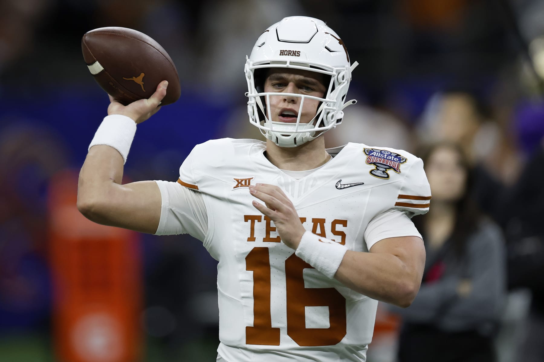 NEW ORLEANS, LOUISIANA - JANUARY 01: Arch Manning #16 of the Texas Longhorns warms up prior to playing against the Washington Huskies during the CFP Semifinal Allstate Sugar Bowl at Caesars Superdome on January 01, 2024 in New Orleans, Louisiana. (Photo by Chris Graythen/Getty Images)