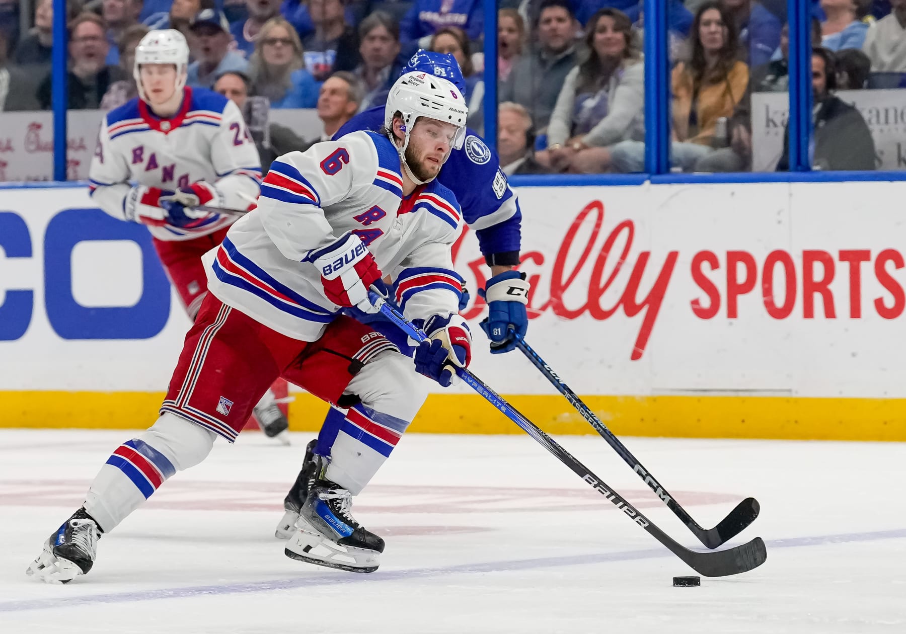 TAMPA, FL - MARCH 14: New York Rangers defenseman Zac Jones (6) skates with the puck during the NHL Hockey match between the Tampa Bay Lightning and New York Rangers on March 14, 2024 at Amalie Arena in Tampa, FL. (Photo by Andrew Bershaw/Icon Sportswire via Getty Images)