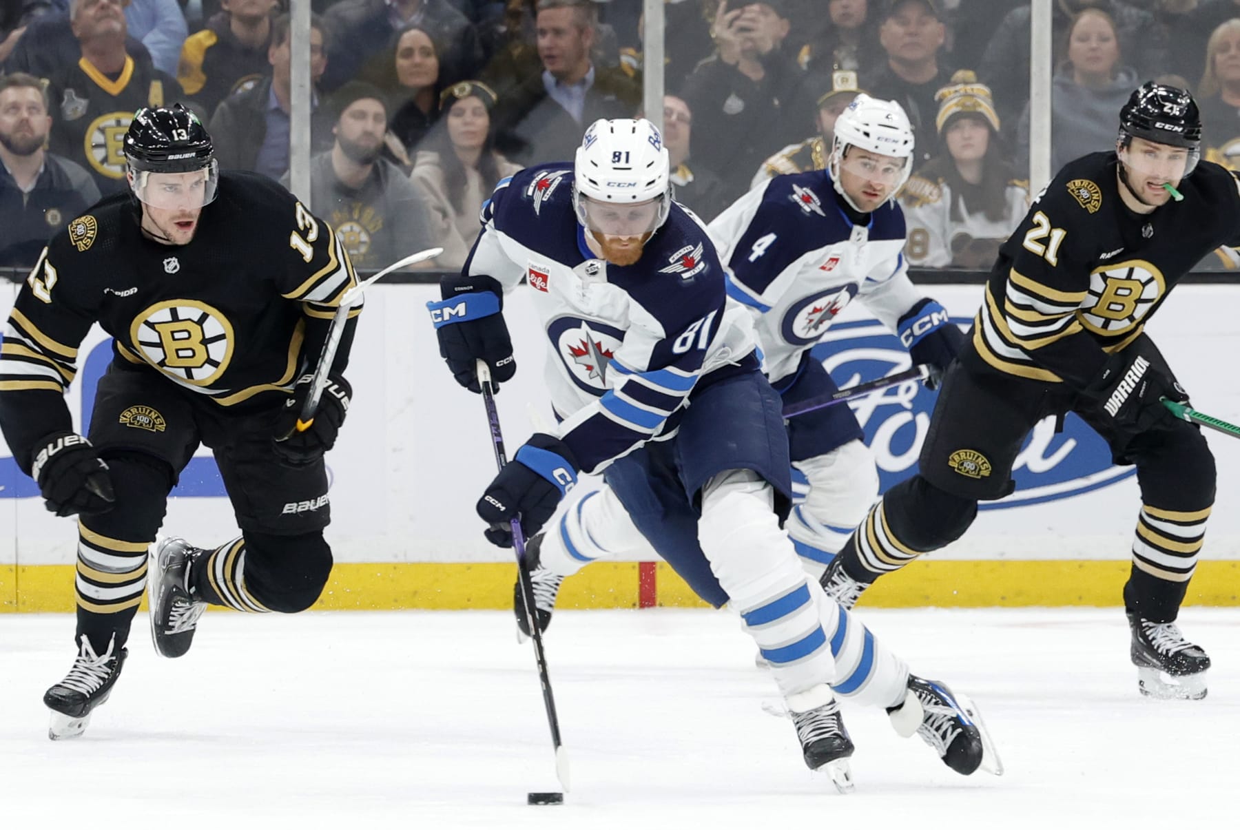 BOSTON, MA - JANUARY 22: Winnipeg Jets left wing Kyle Connor (81) picks up the puck during a game between the Boston Bruins and the Winnipeg Jets on January 22, 2024, at TD Garden in Boston, Massachusetts. (Photo by Fred Kfoury III/Icon Sportswire via Getty Images)