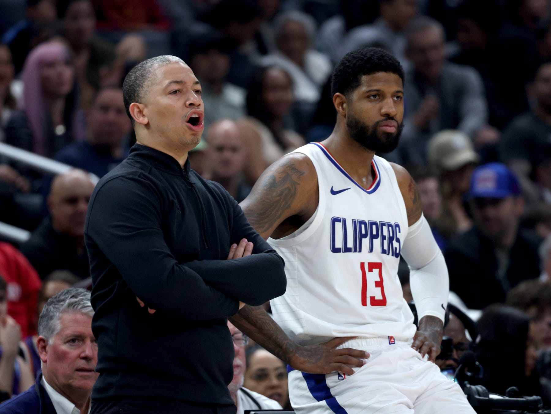 LOS ANGELES, CALIFORNIA - JANUARY 21: Head coach Tyronn Lue and Paul George #13 of the LA Clippers react from the sideline during the first half against the Brooklyn Nets at Crypto.com Arena on January 21, 2024 in Los Angeles, California. User is consenting to the terms and conditions of the Getty Images License Agreement. (Photo by Harry How/Getty Images)
