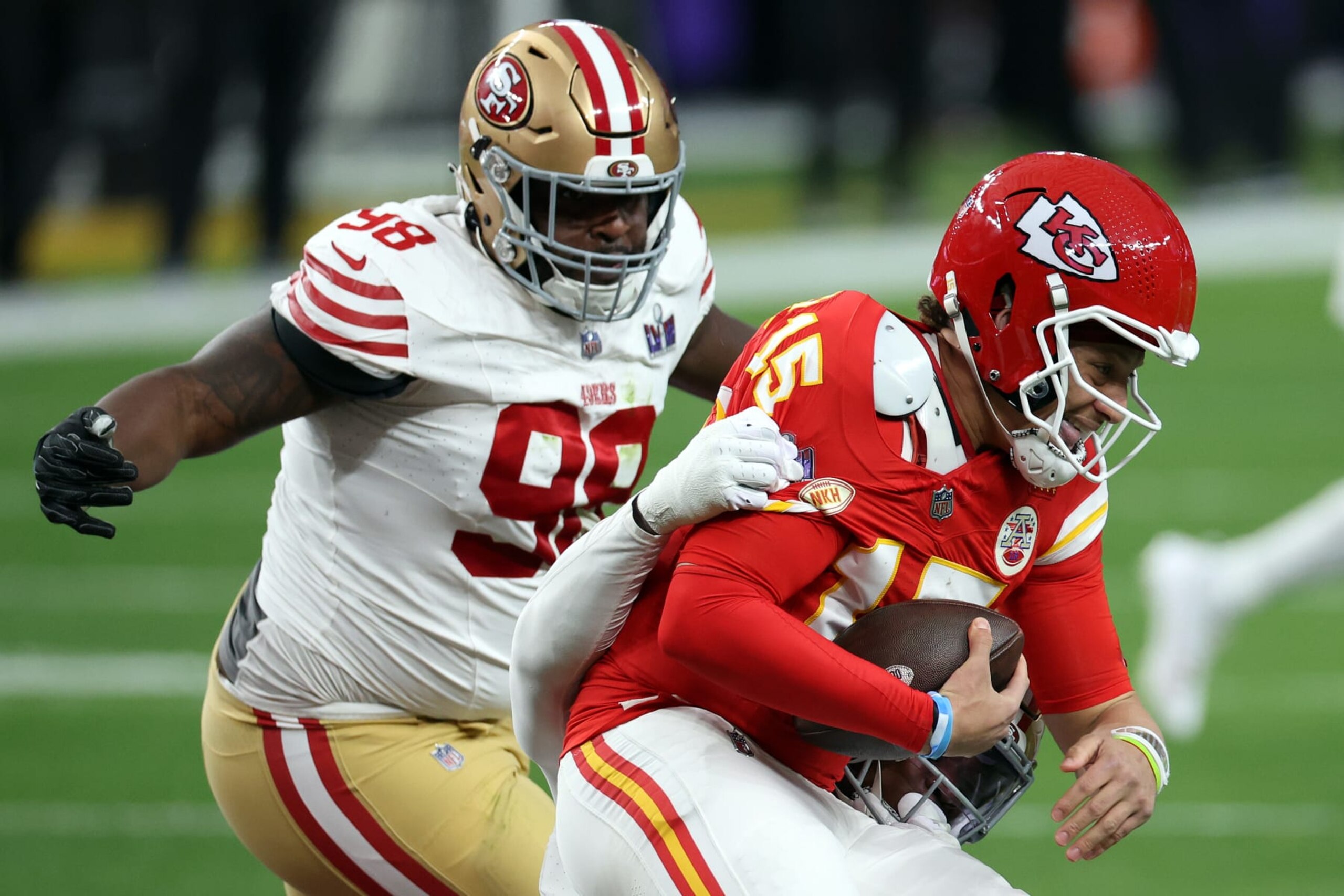 LAS VEGAS, NEVADA - FEBRUARY 11: Patrick Mahomes #15 of the Kansas City Chiefs is sacked by Randy Gregory #5 and Javon Hargrave #98 of the San Francisco 49ers during the first quarter during Super Bowl LVIII at Allegiant Stadium on February 11, 2024 in Las Vegas, Nevada. (Photo by Harry How/Getty Images)