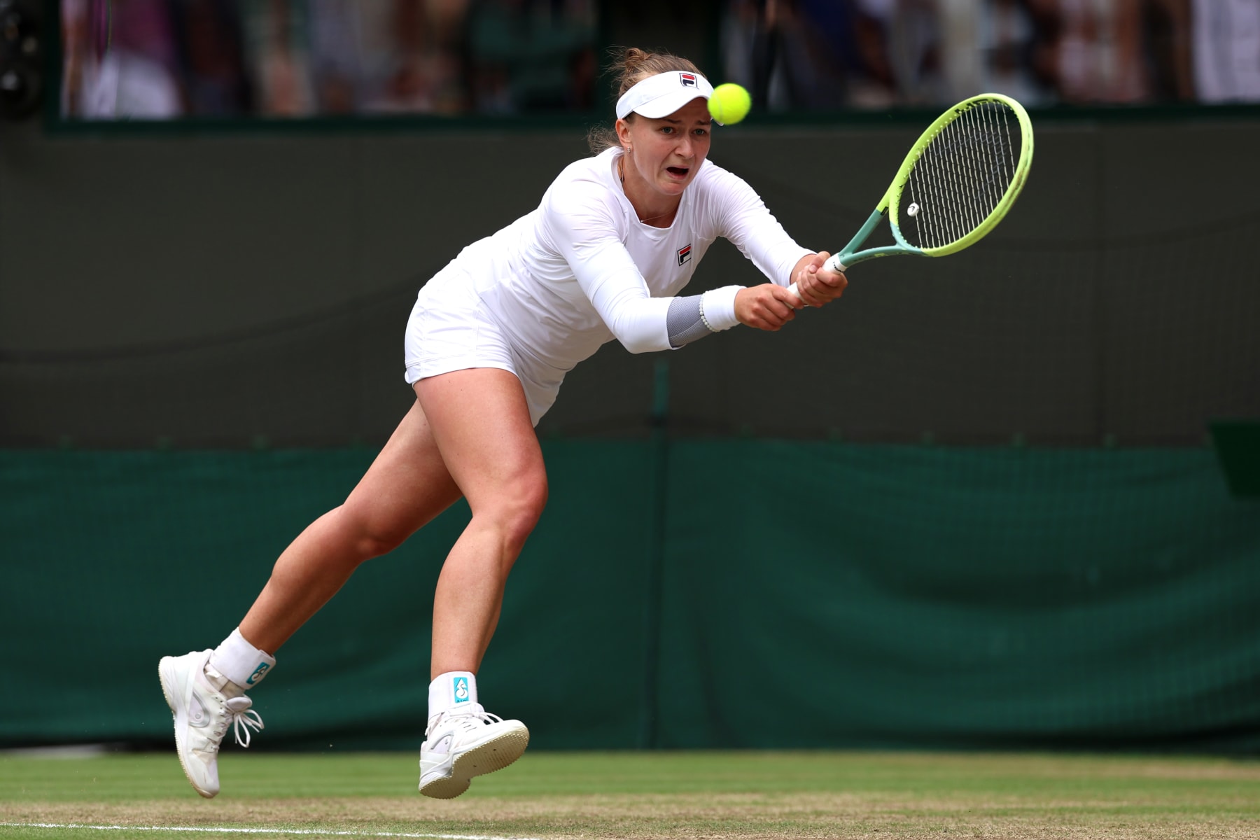 LONDON, ENGLAND - JULY 10: Barbora Krejcikova of Czechia plays a backhand against Jelena Ostapenko of Latvia in the Ladies' Singles Quarter Final match during day ten of The Championships Wimbledon 2024 at All England Lawn Tennis and Croquet Club on July 10, 2024 in London, England. (Photo by Sean M. Haffey/Getty Images)