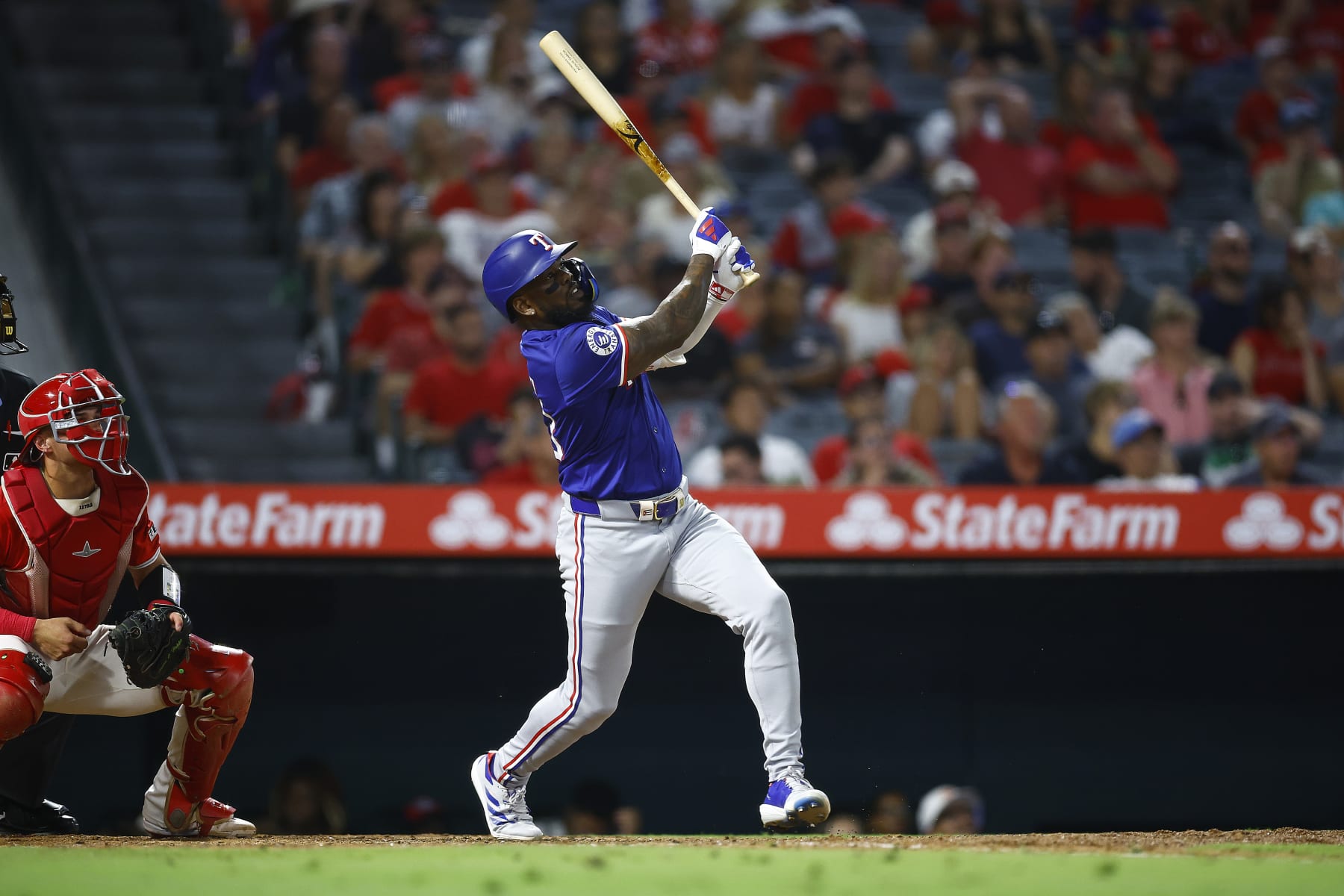 ANAHEIM, CALIFORNIA - JULY 09: Adolis García #53 of the Texas Rangers hits a home run against the Los Angeles Angels in the eighth inning at Angel Stadium of Anaheim on July 09, 2024 in Anaheim, California. (Photo by Ronald Martinez/Getty Images)