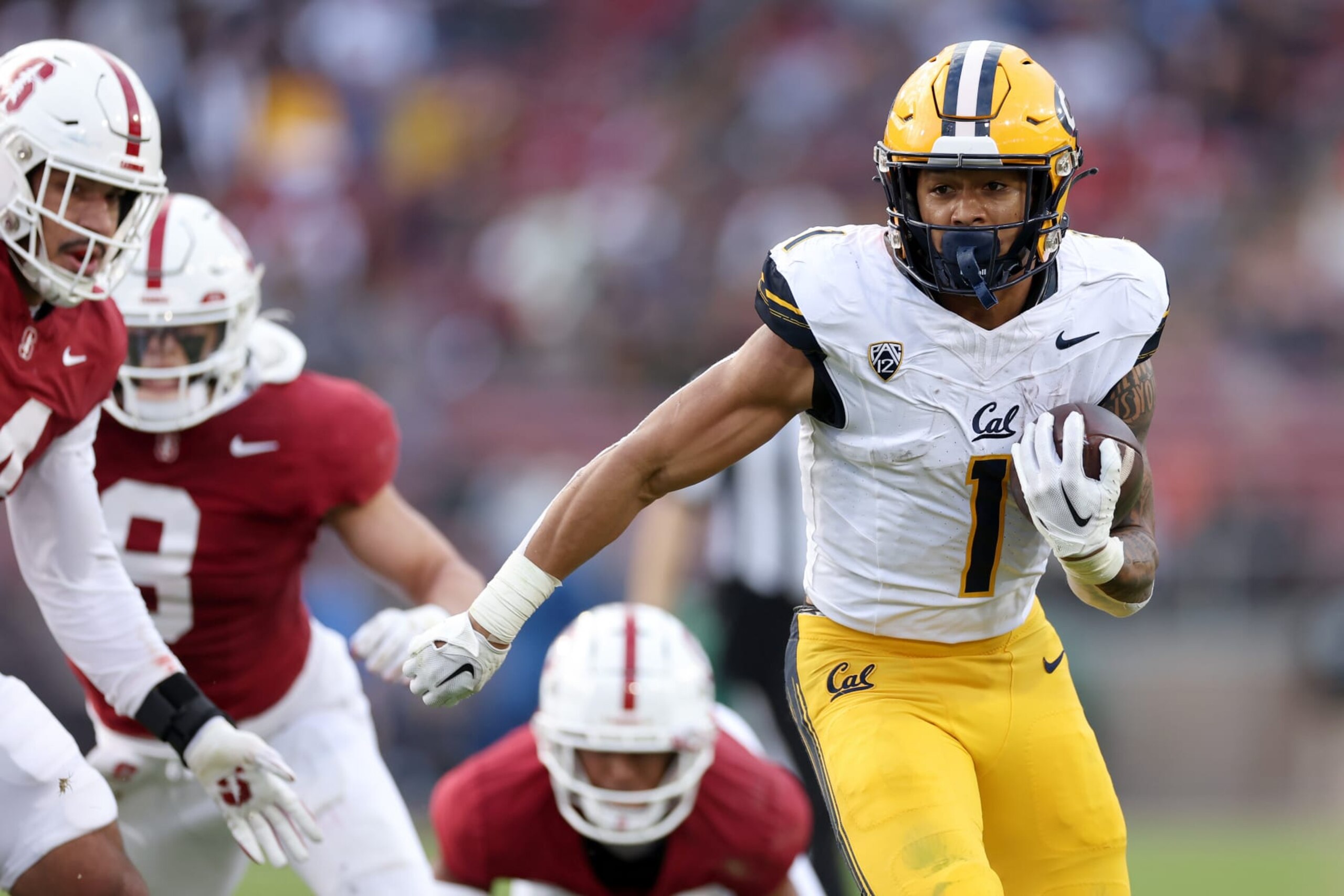 STANFORD, CALIFORNIA - NOVEMBER 18: Jaydn Ott #1 of the California Golden Bears runs with the ball against the Stanford Cardinal in the first half at Stanford Stadium on November 18, 2023 in Stanford, California. (Photo by Ezra Shaw/Getty Images)