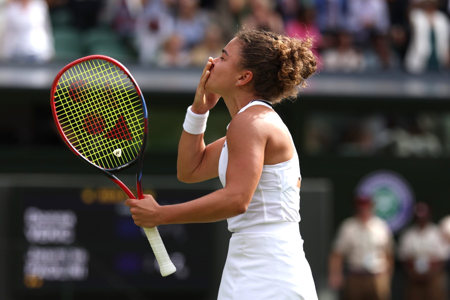 LONDON, ENGLAND - JULY 11: Jasmine Paolini of Italy blows a kiss to the crowd as she celebrates winning match point against Donna Vekic of Croatia in the Ladies' Singles Semi-Final match during day eleven of The Championships Wimbledon 2024 at All England Lawn Tennis and Croquet Club on July 11, 2024 in London, England. (Photo by Clive Brunskill/Getty Images)