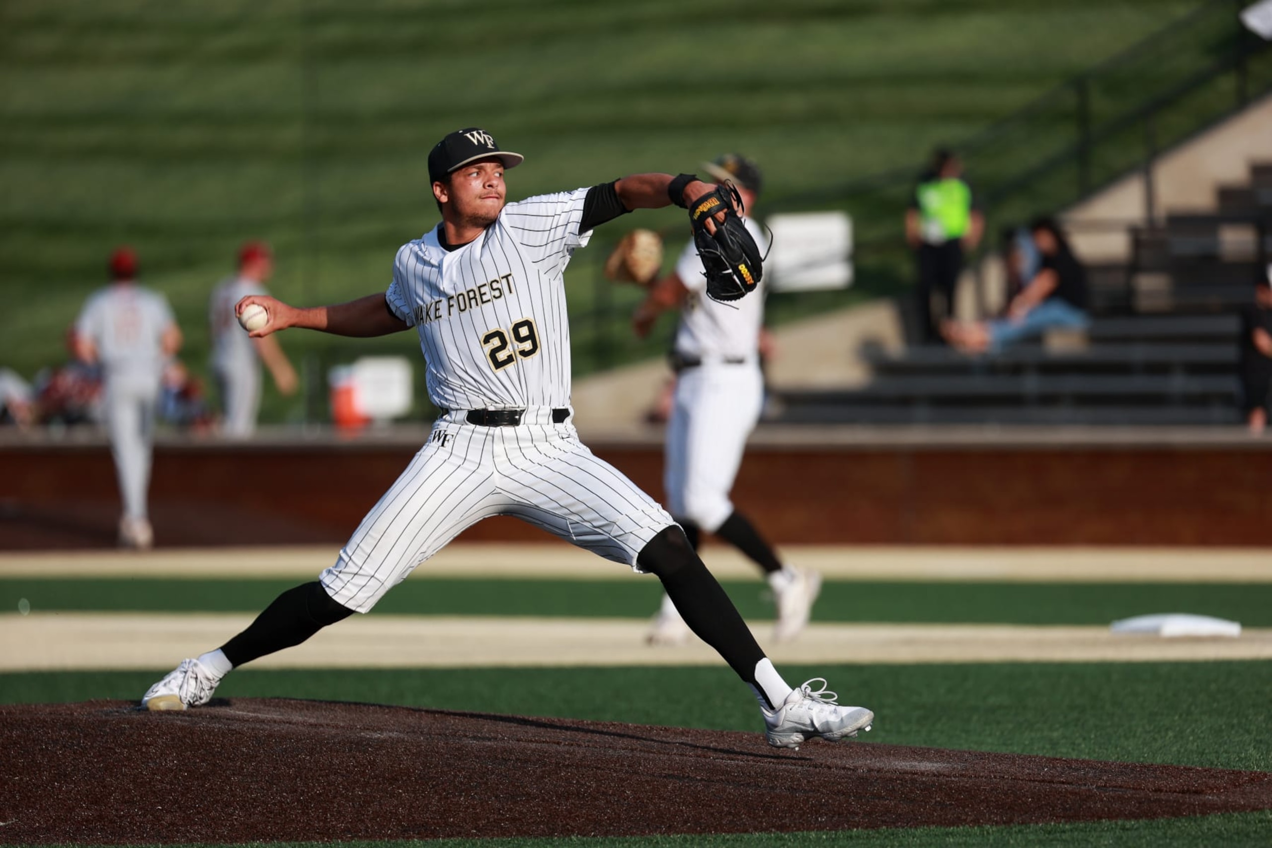 WINSTON SALEM, NORTH CAROLINA - APRIL 19: Chase Burns #29 of the Wake Forest Demon Deacons makes a pitch against the Florida State Seminoles at David F. Couch Ballpark on April 19, 2024 in Winston Salem, North Carolina. (Photo by Isaiah Vazquez/Getty Images)