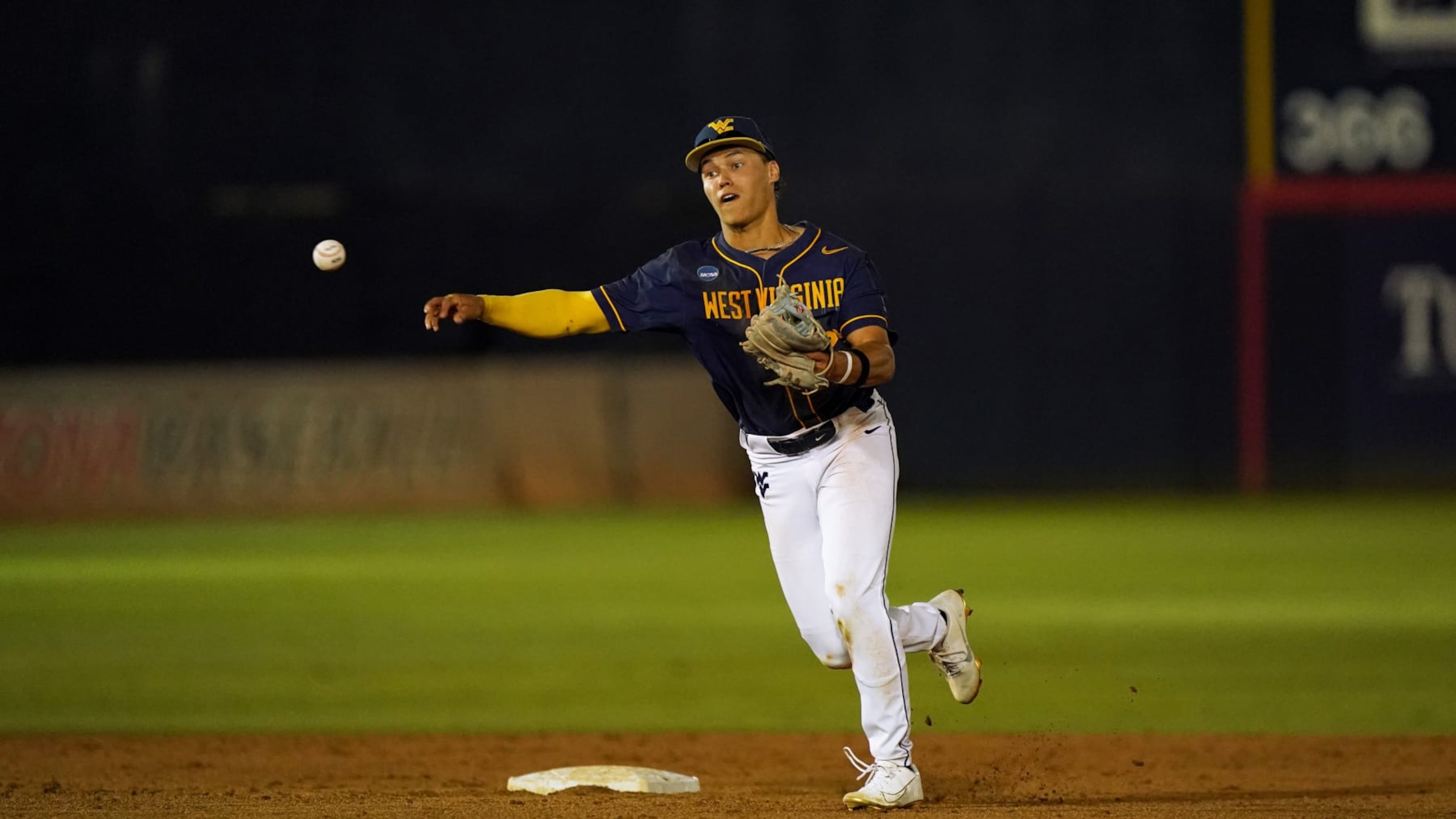 TUCSON, ARIZONA - JUNE 01: JJ Wetherholt #27 of West Virginia University makes a throw to first base to complete a double play against Grand Canyon University at Hi Corbett Field on June 1, 2024 in Tucson, Arizona. (Photo by Patrick Mulligan/Getty Images) TUCSON, ARIZONA - JUNE 01: JJ Wetherholt #27 of West Virginia University makes a throw to first base to complete a double play against Grand Canyon University at Hi Corbett Field on June 1, 2024 in Tucson, Arizona. (Photo by Patrick Mulligan/Getty Images)