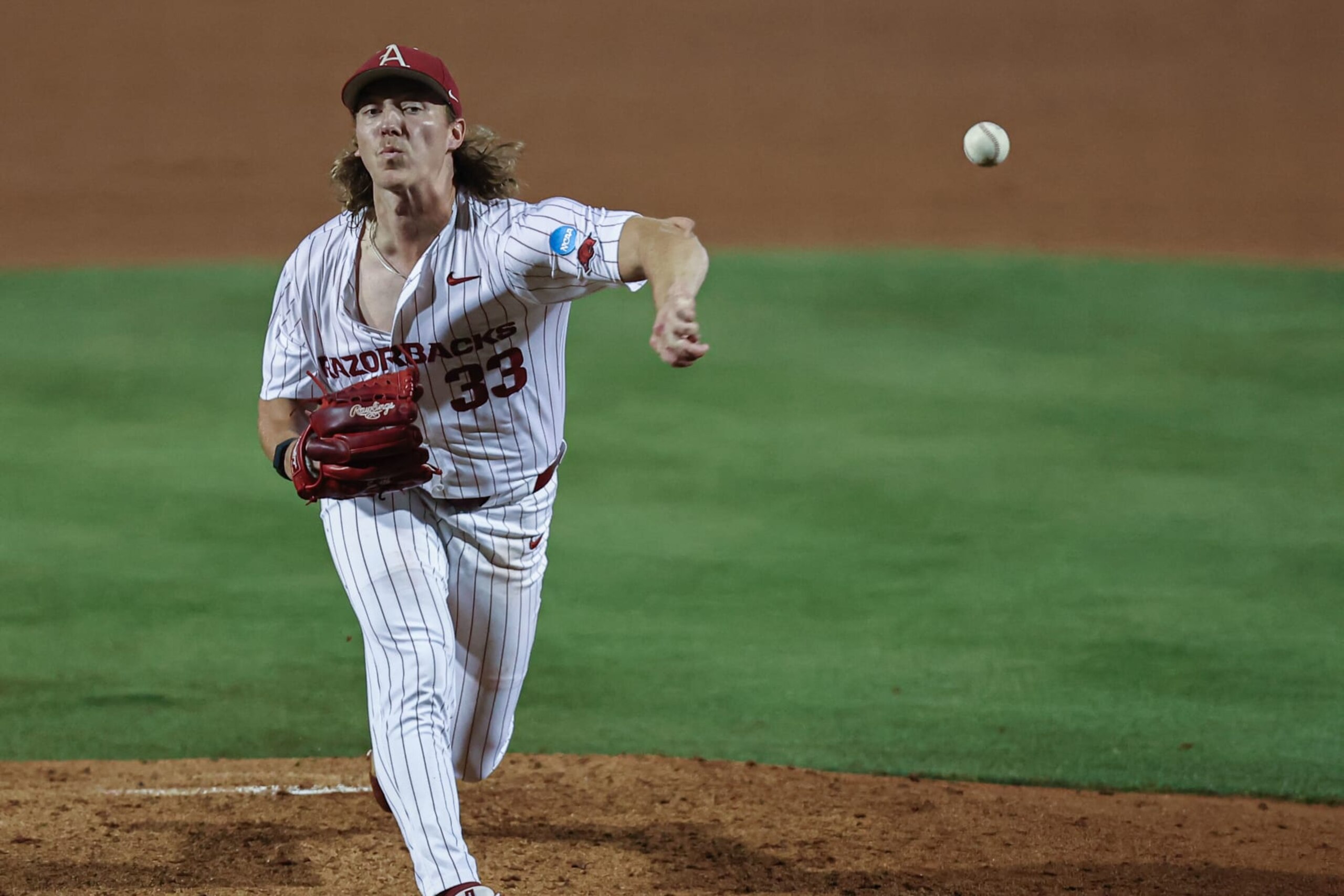 FAYETTEVILLE, AR - June 01: Arkansas pitcher Hagen Smith (33) pitches in the NCAA regional game between the Arkansas Razorbacks and the Kansas State Wildcats on June 01, 2024, at Baum Stadium in Fayetteville, AR.  (Photo by John Bunch/Icon Sportswire via Getty Images)