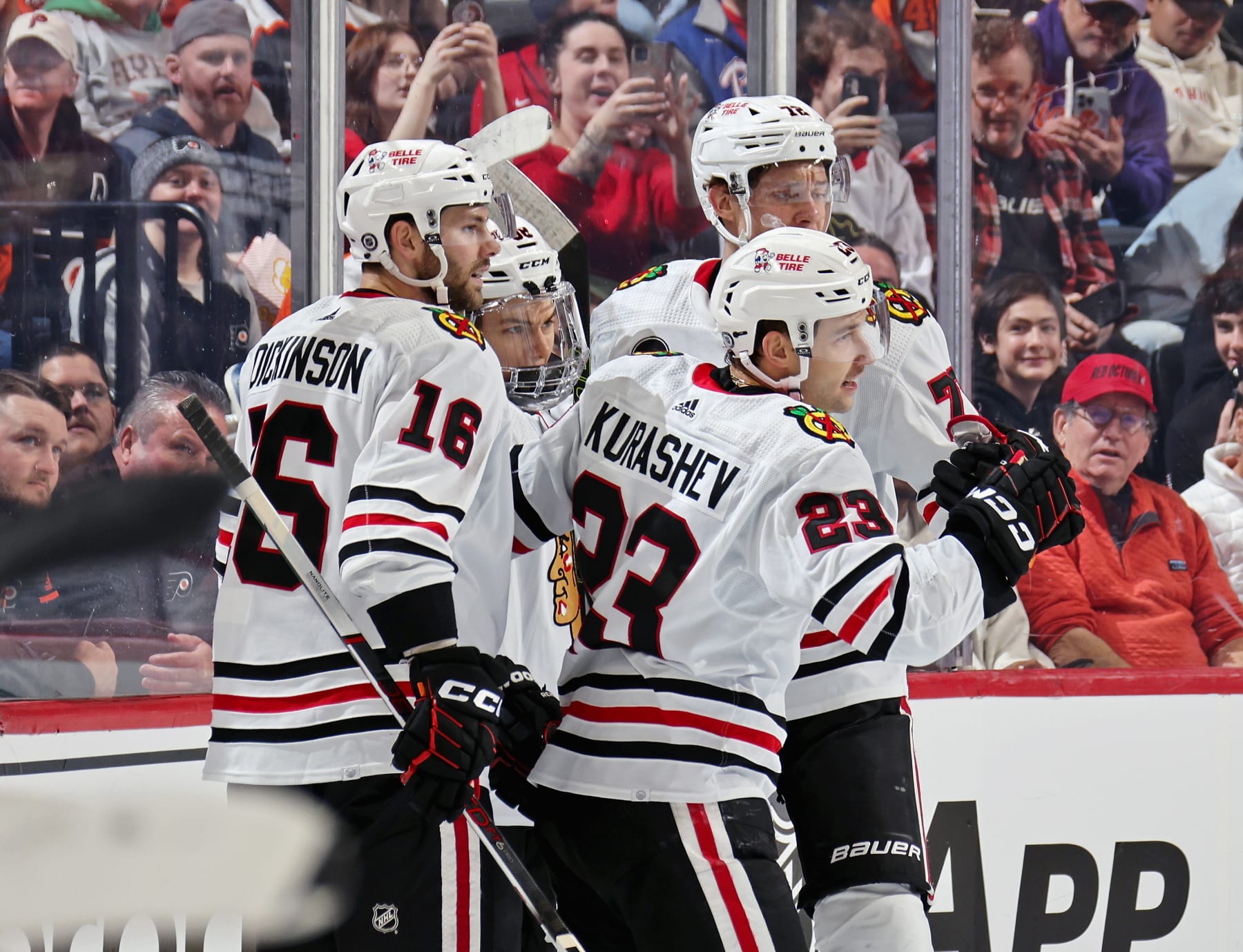 PHILADELPHIA, PENNSYLVANIA - MARCH 30: Philipp Kurashev #23 of the Chicago Blackhawks celebrates his first period goal against the Philadelphia Flyers with Jason Dickinson #16, Connor Bedard #98, and Alex Vlasic #72 at the Wells Fargo Center on March 30, 2024 in Philadelphia, Pennsylvania. (Photo by Len Redkoles/NHLI via Getty Images)