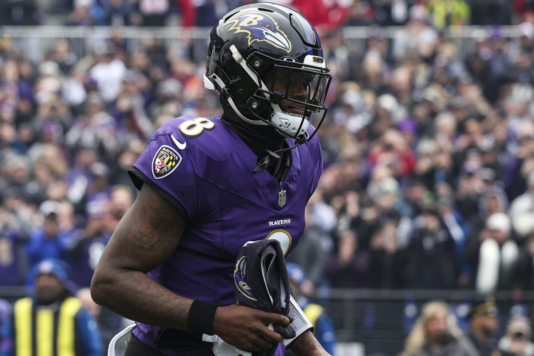 BALTIMORE, MD - JANUARY 28: Lamar Jackson #8 of the Baltimore Ravens runs out of the tunnel prior to the AFC Championship NFL football game against the Kansas City Chiefs at M&T Bank Stadium on January 28, 2024 in Baltimore, Maryland. (Photo by Perry Knotts/Getty Images)