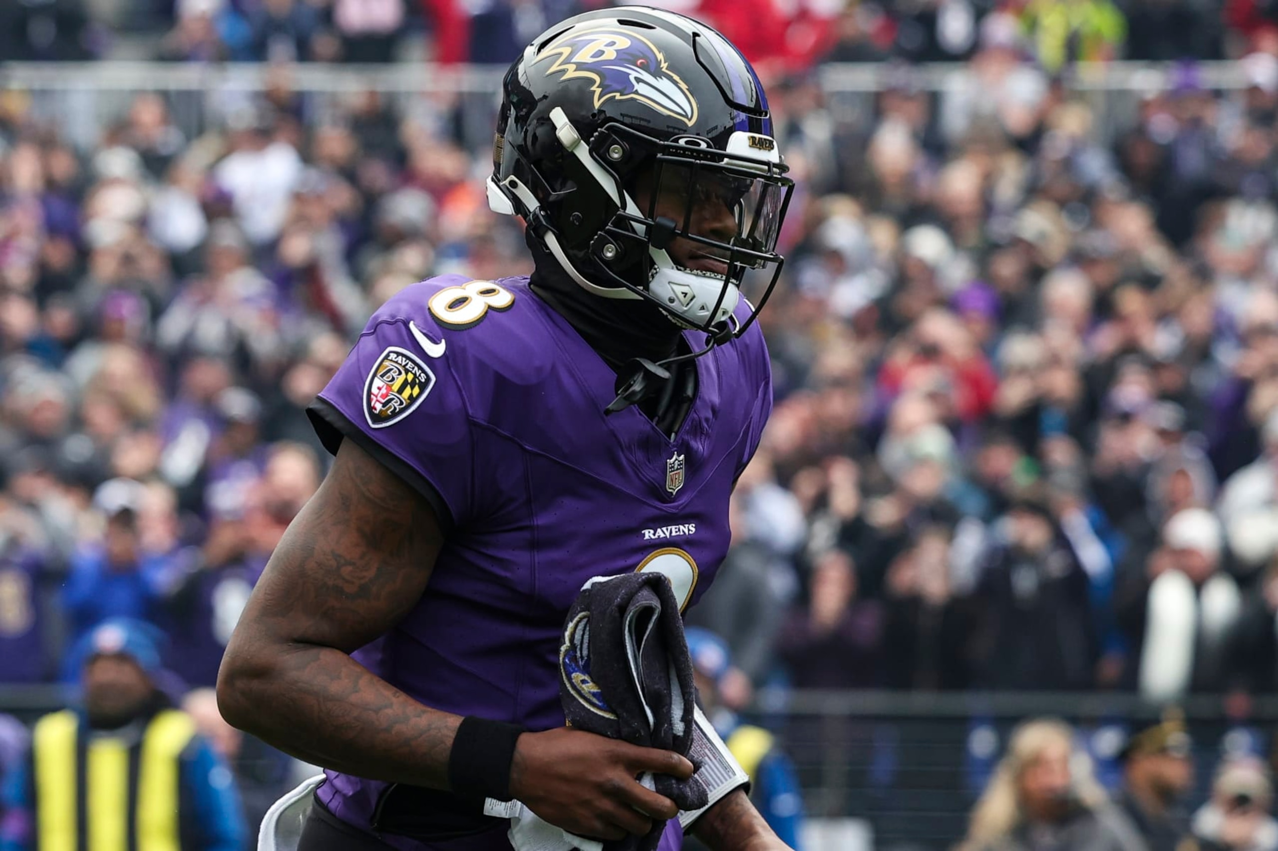 BALTIMORE, MD - JANUARY 28: Lamar Jackson #8 of the Baltimore Ravens runs out of the tunnel prior to the AFC Championship NFL football game against the Kansas City Chiefs at M&T Bank Stadium on January 28, 2024 in Baltimore, Maryland. (Photo by Perry Knotts/Getty Images)