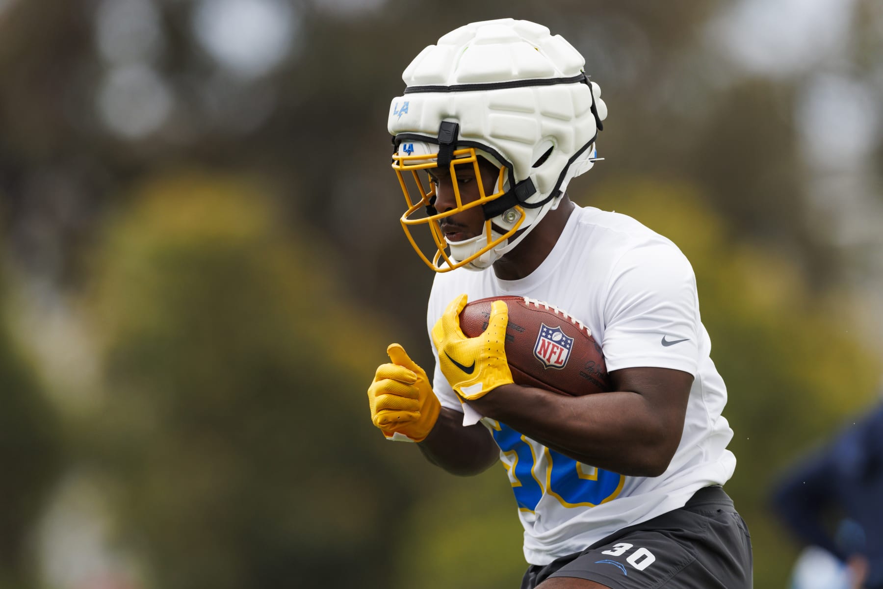 COSTA MESA, CA - MAY 20: Kimani Vidal #30 of the Los Angeles Chargers runs with the ball during an NFL football organized team activity at Hoag Performance Center on May 20, 2024 in Costa Mesa, California. (Photo by Ric Tapia/Getty Images)