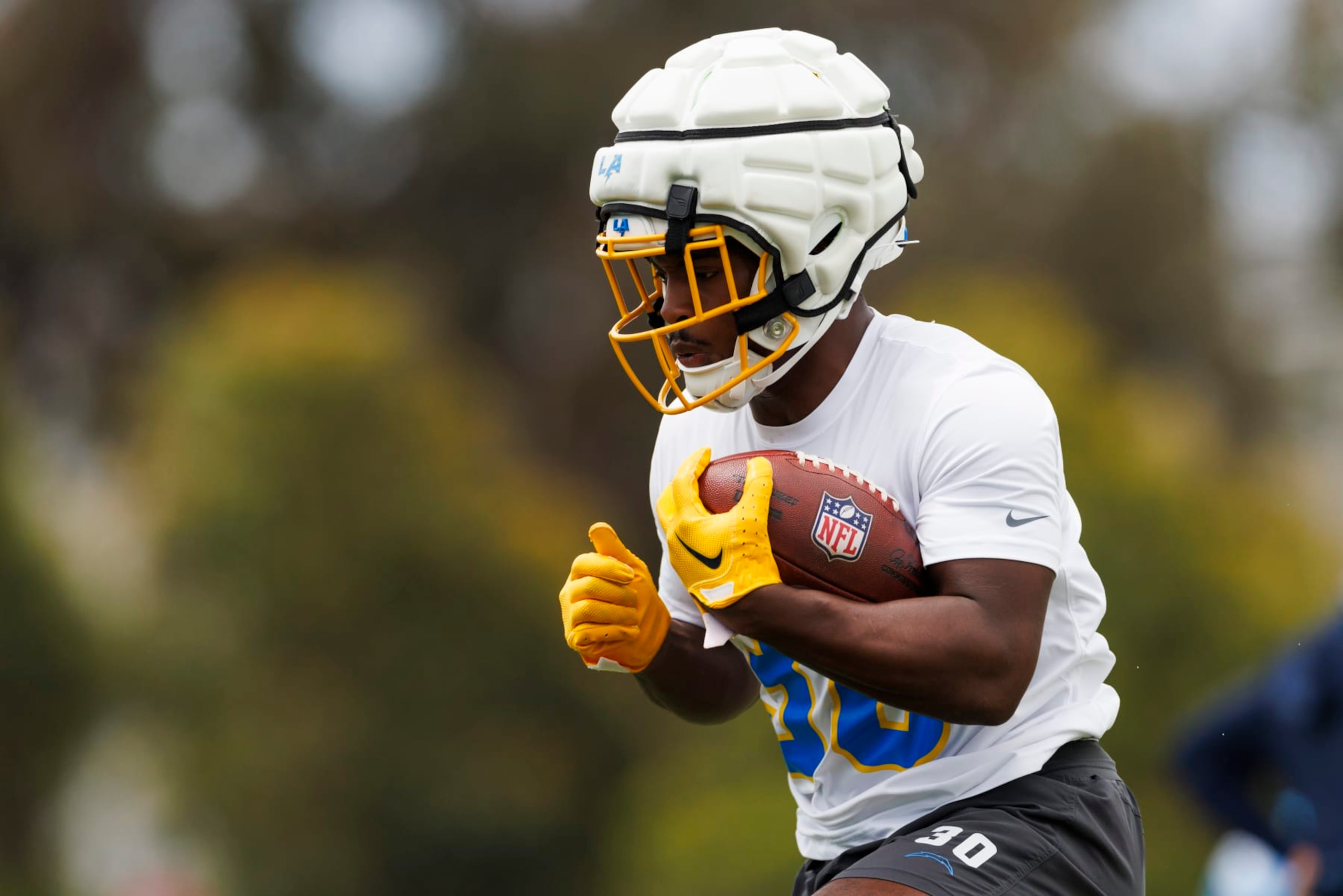 COSTA MESA, CA - MAY 20: Kimani Vidal #30 of the Los Angeles Chargers runs with the ball during an NFL football organized team activity at Hoag Performance Center on May 20, 2024 in Costa Mesa, California. (Photo by Ric Tapia/Getty Images)