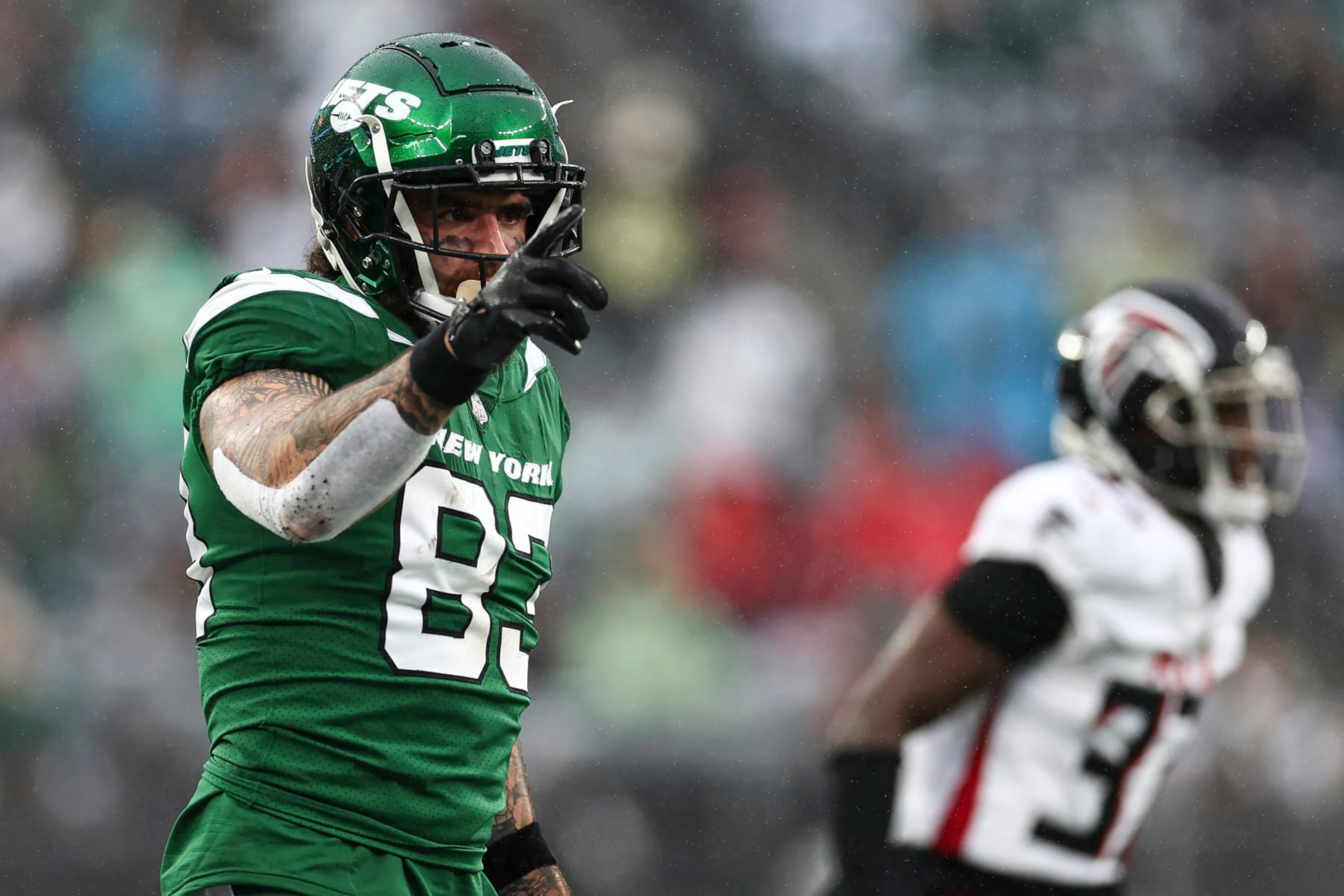 EAST RUTHERFORD, NJ - DECEMBER 3: Tyler Conklin #83 of the New York Jets celebrates after a play during the first quarter of an NFL football game against the Atlanta Falcons at MetLife Stadium on December 3, 2023 in East Rutherford, New Jersey. (Photo by Kevin Sabitus/Getty Images)