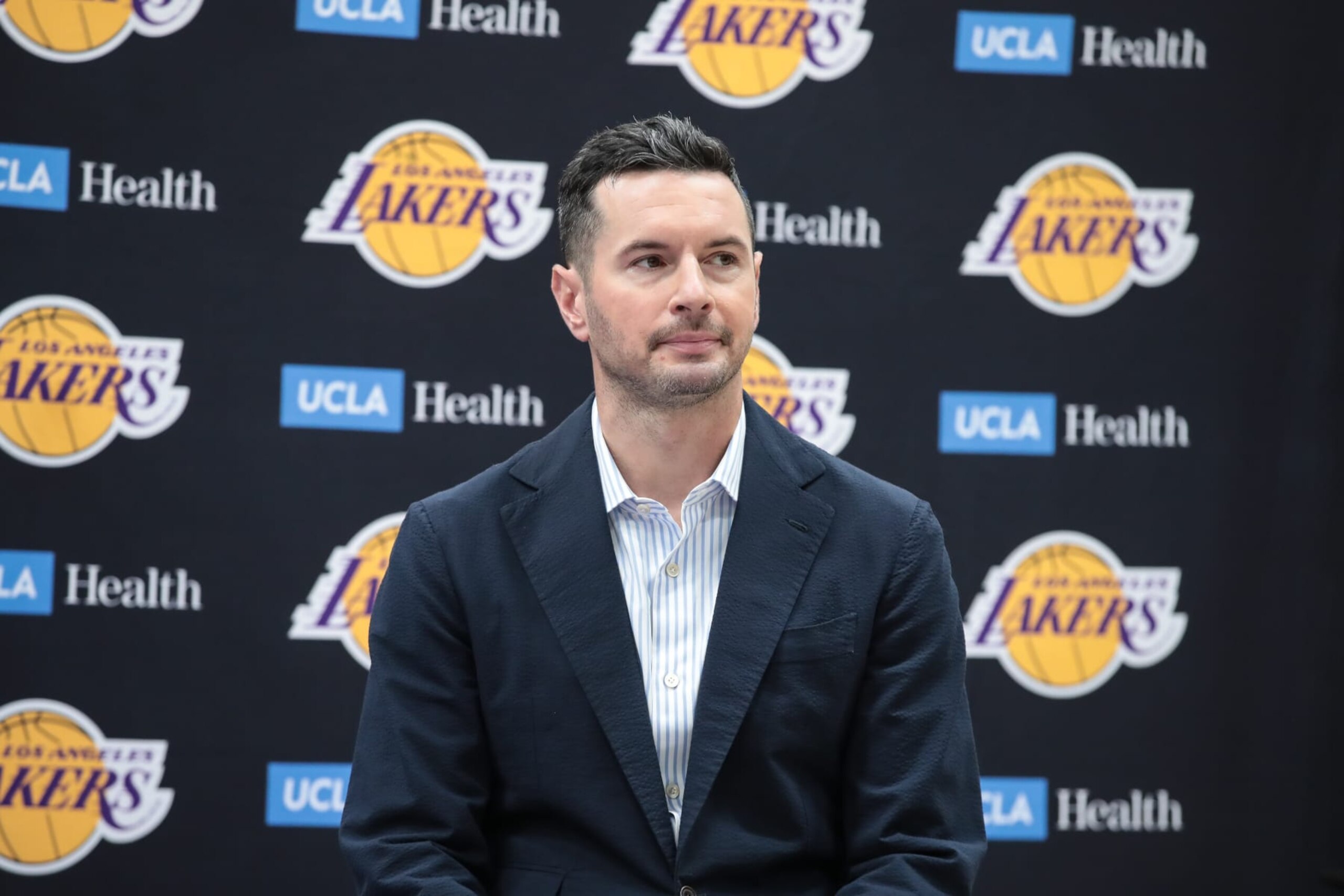 EL SEGUNDO, CA - JULY 02:  Los Angeles Lakers head coach J.J. Redick smirks during the Los Angeles Lakers welcome press conference for their NBA Draft picks on July 02, 2024, at UCLA Health Training Center in El Segundo, CA. (Photo by Jevone Moore/Icon Sportswire via Getty Images)