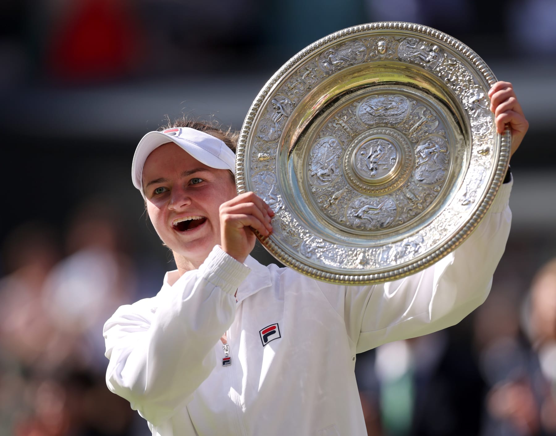 LONDON, ENGLAND - JULY 13: Barbora Krejcikova of Czechia poses with the Ladies' Singles Trophy following victory against Jasmine Paolini of Italy during her Ladies' Singles Final match during day thirteen of The Championships Wimbledon 2024 at All England Lawn Tennis and Croquet Club on July 13, 2024 in London, England. (Photo by Clive Brunskill/Getty Images)