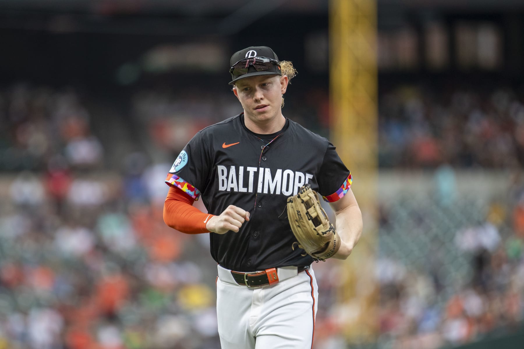 BALTIMORE, MD - JULY 12: Baltimore Orioles outfielder Heston Kjerstad (13) jogs off the field between innings during the New York Yankees versus Baltimore Orioles MLB game at Oriole Park at Camden Yards on July 12, 2024, in Baltimore, MD. (Photo by Charles Brock/Icon Sportswire via Getty Images)