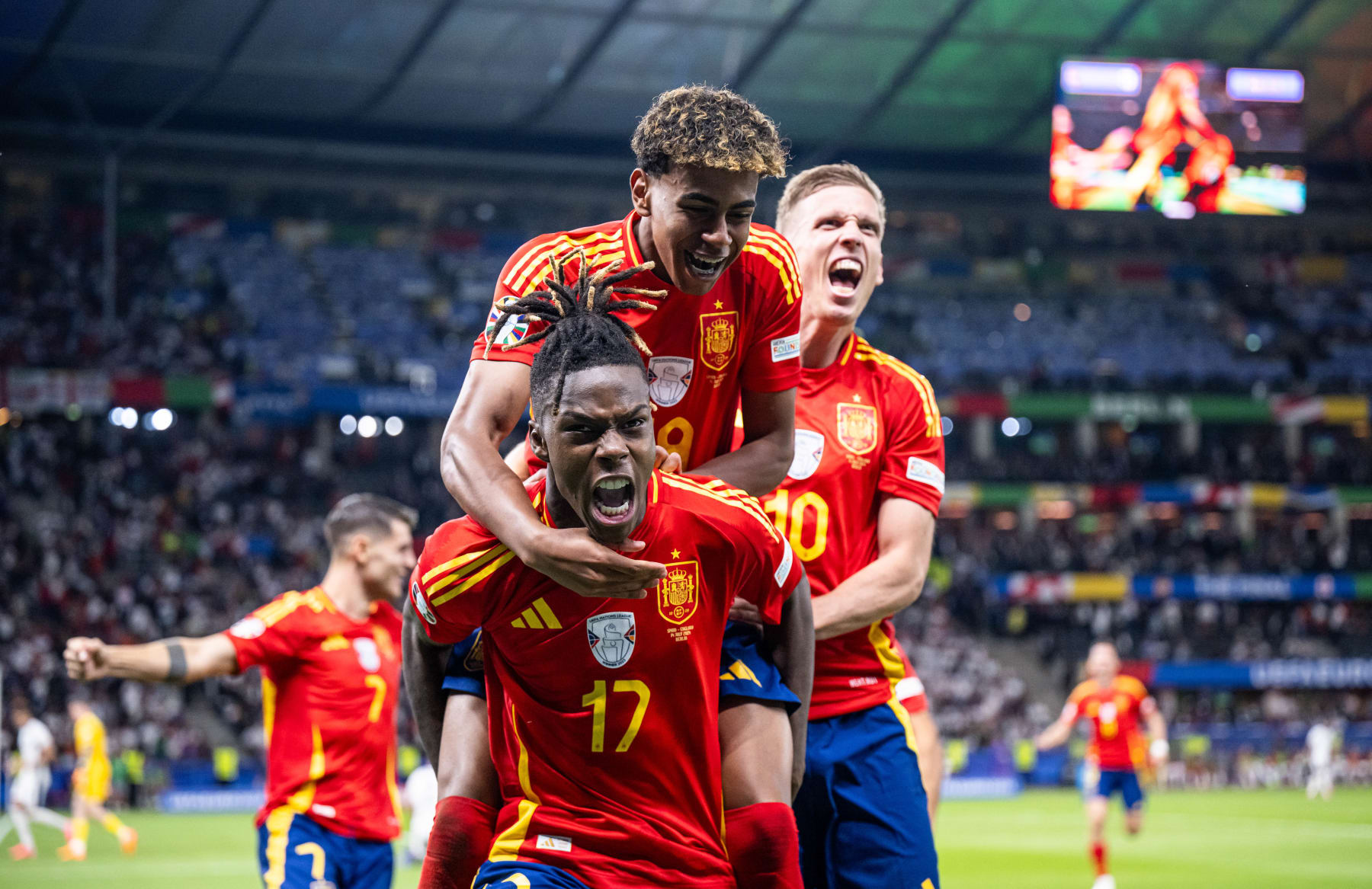 BERLIN, GERMANY - JULY 14: Nico Williams of Spain (17) celebrates after scoring his team's first goal with Lamine Yamal (19) during the UEFA EURO 2024 final match between Spain and England at Olympiastadion on July 14, 2024 in Berlin, Germany. (Photo by Marvin Ibo Guengoer - GES Sportfoto/Getty Images)