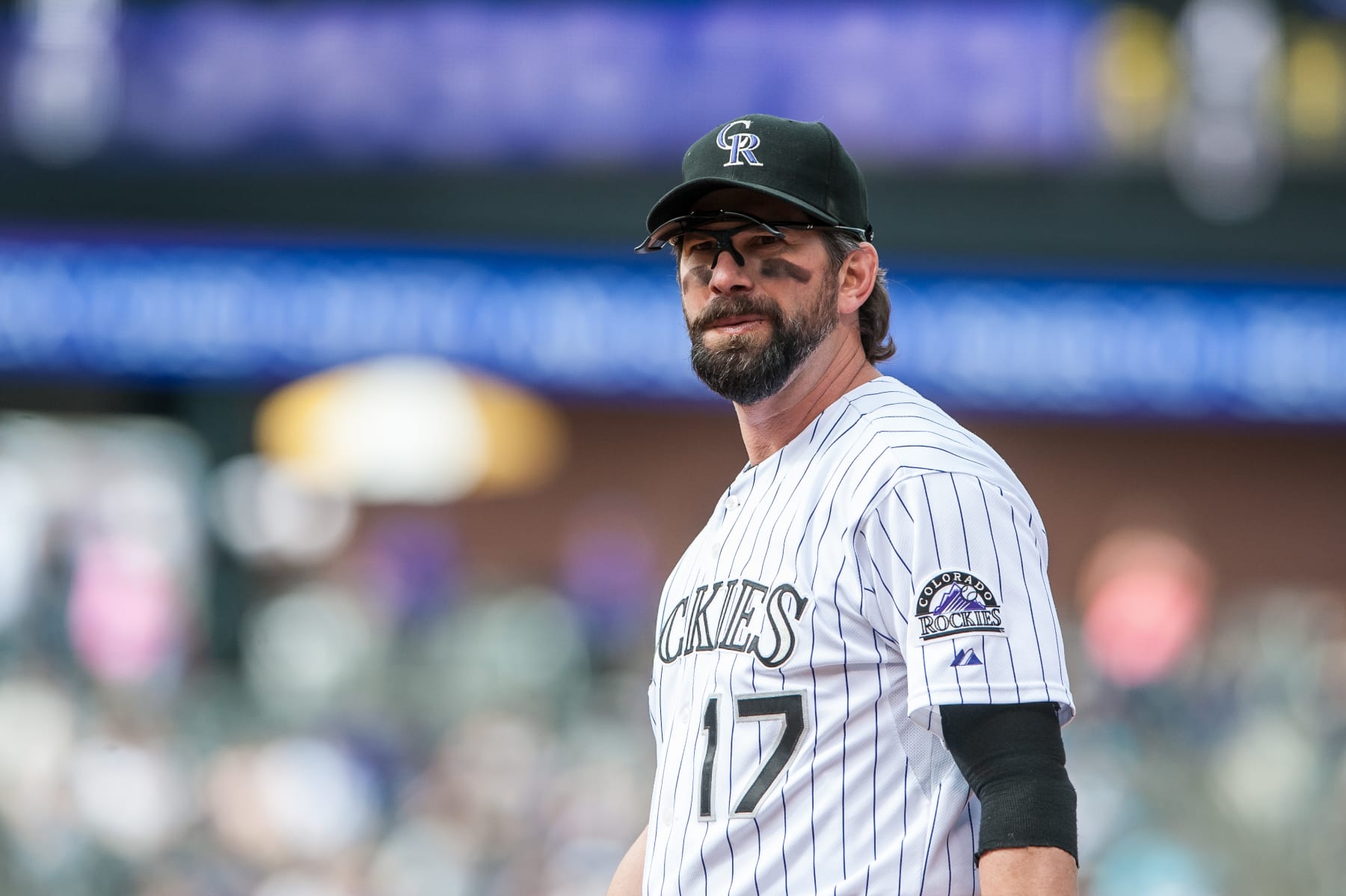 DENVER, CO - SEPTEMBER 22:  Todd Helton #17 of the Colorado Rockies looks on during a game against the Arizona Diamondbacks at Coors Field on September 22, 2013 in Denver, Colorado.  (Photo by Dustin Bradford/Getty Images)