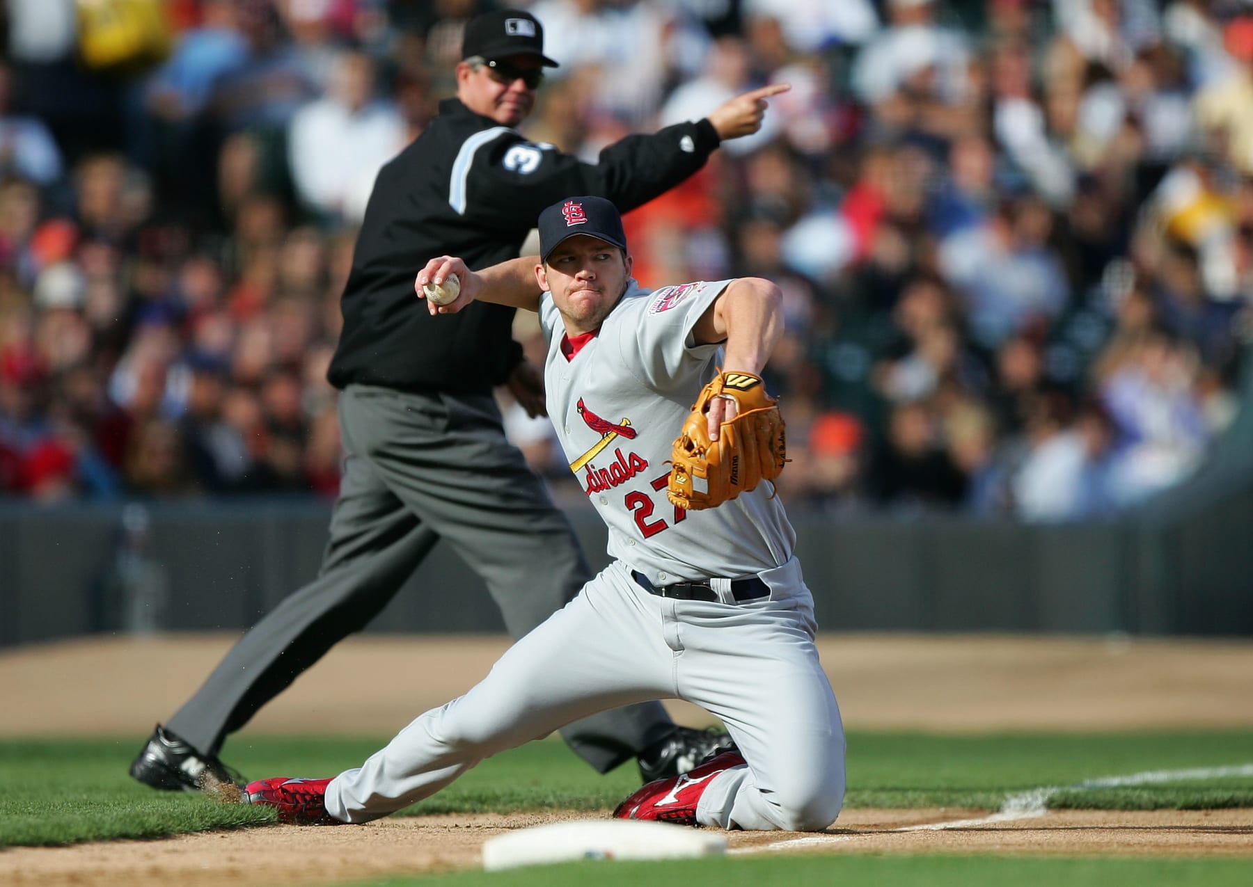 SAN FRANCISCO - JULY 10:  Scott Rolen #27 of the St. Louis Cardinals throws out Pedro Feliz #7 of the San Francisco Giants in the second inning at SBC Park on July 10, 2005 in San Francisco, California.  (Photo by Jed Jacobsohn/Getty Images)