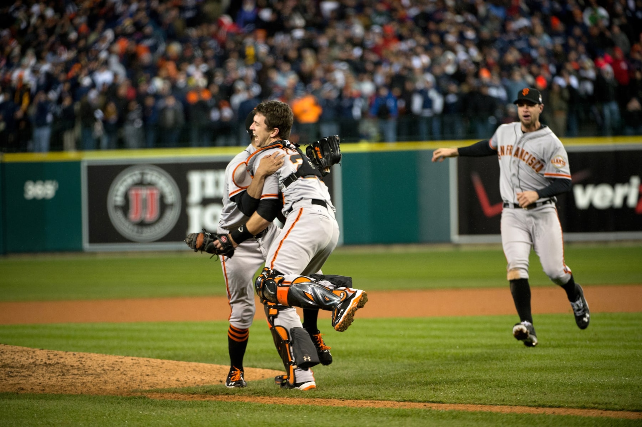 Baseball: World Series: San Francisco Giants Buster Posey (28) and Sergio Romo (54) victorious on field after winning Game 4 and championship series vs Detroit Tigers at Comerica Park. 
Detroit, MI 10/28/2012
CREDIT: John Biever (Photo by John Biever /Sports Illustrated via Getty Images)
(Set Number: X155697 TK2 R9 F49 )