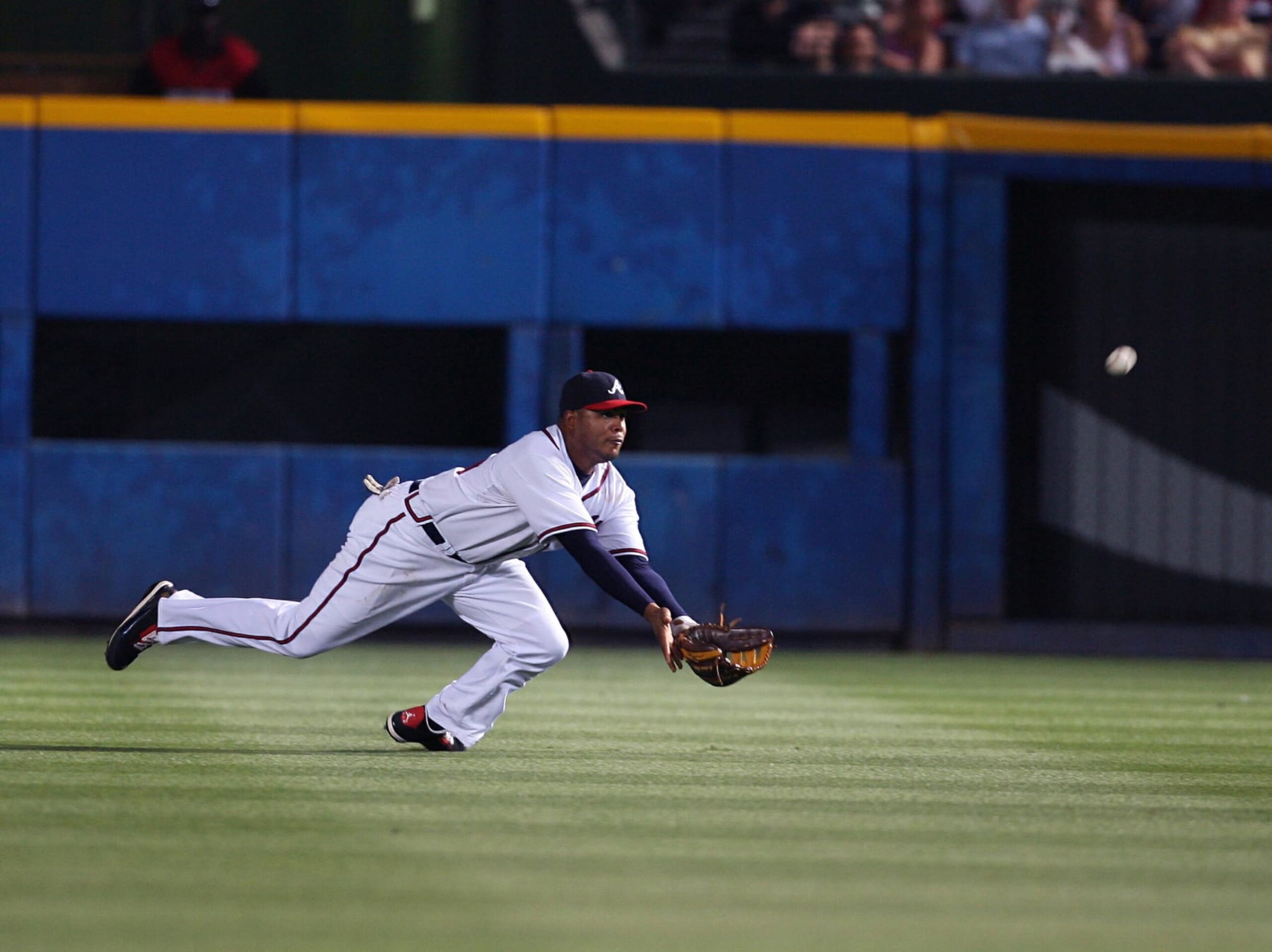 ATLANTA - JUNE 9: Andruw Jones #25 of the Atlanta Braves makes a diving catch against the Chicago Cubs at Turner Field on June 9, 2007 in Atlanta, Georgia. The Braves defeated the Cubs 9-5. (Photo by Scott Cunningham/Getty Images)